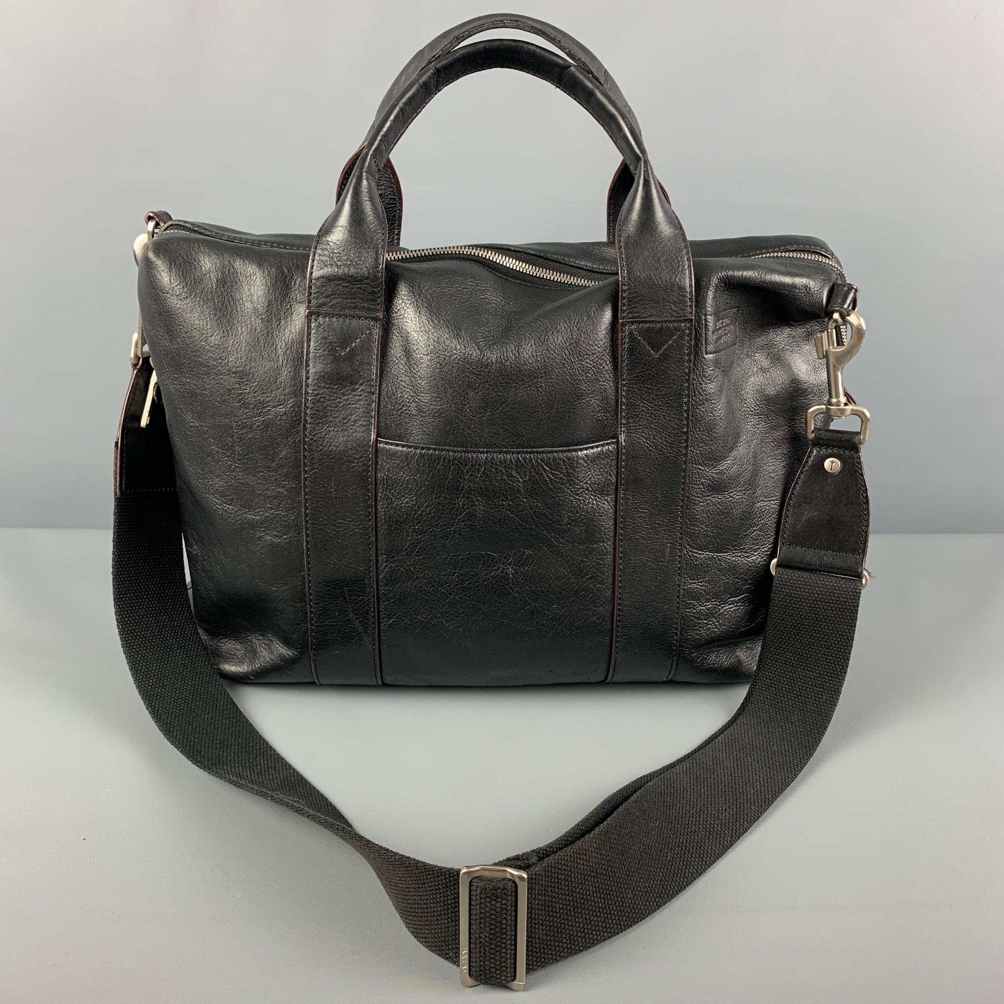 JACK SPADE bag comes in a black leather featuring a messenger style, top handles, detachable shoulder strap, inner pockets, and a top zipper closure. 

Good Pre-Owned Condition.

Measurements:

Length: 16 in.
Width: 3 in.
Height: 12.5 in.
Drop: 20