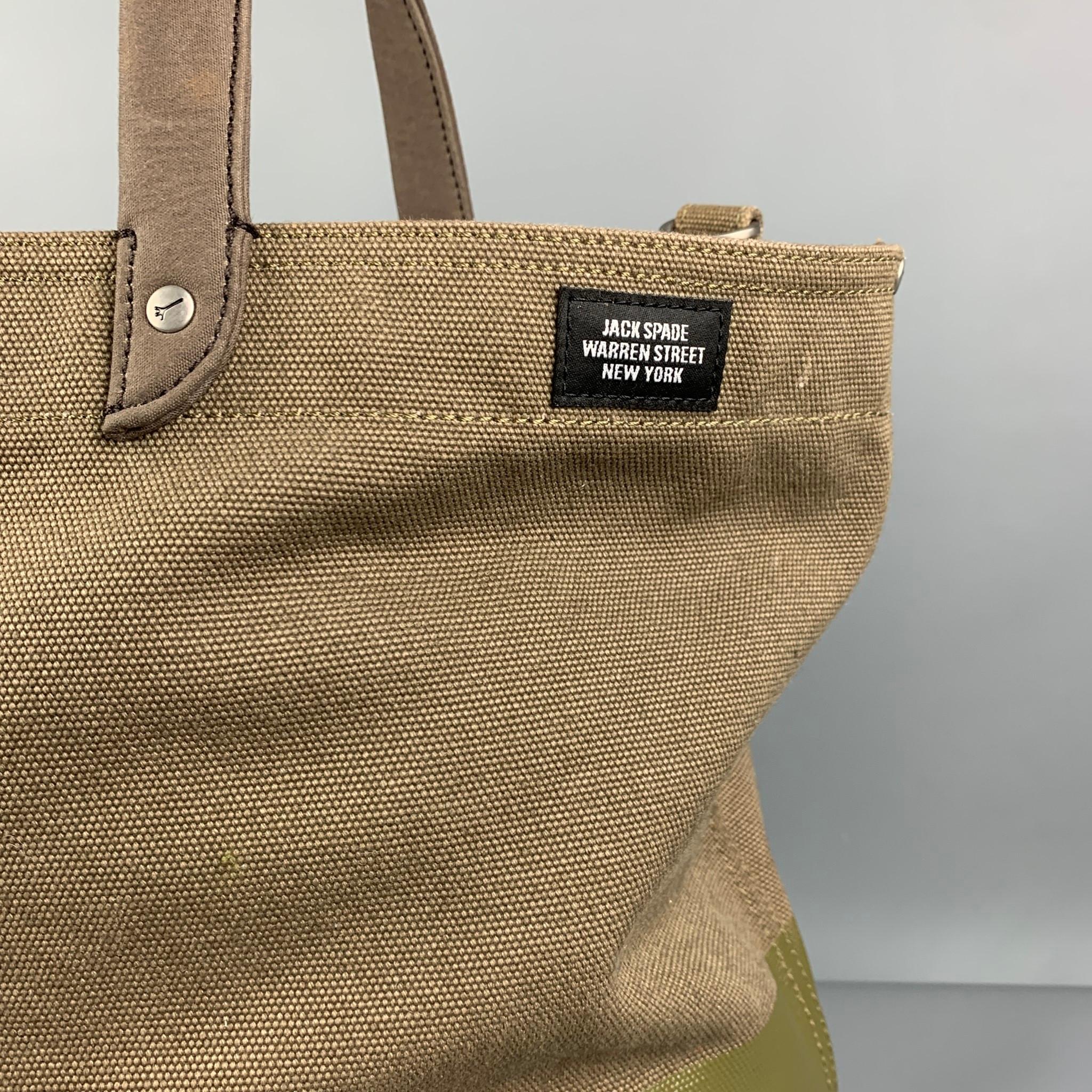 JACK SPADE bag comes in a olive two toned canvas featuring a tote style, detachable strap, inner pocket, and top handles. 

Good Pre-Owned Condition. Minor marks and discoloration at interior.

Measurements:

Length: 15.25 in.
Width: 6 in.
Height: