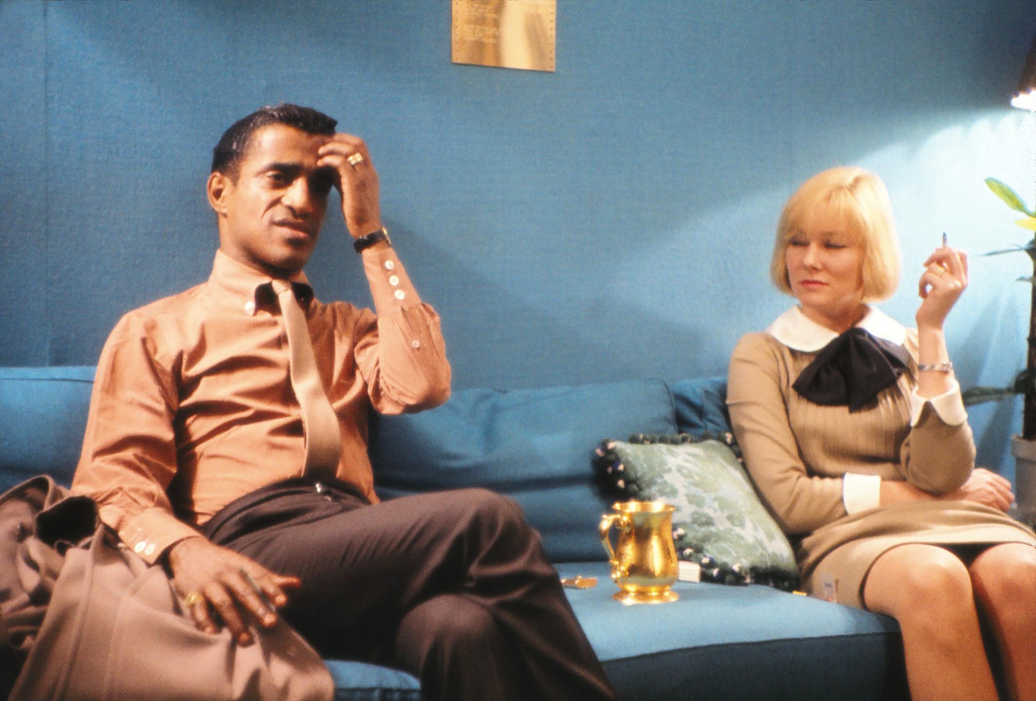 Jack Stager Portrait Photograph - Sammy Davis Jr. and May Britt Seated on Couch Fine Art Print