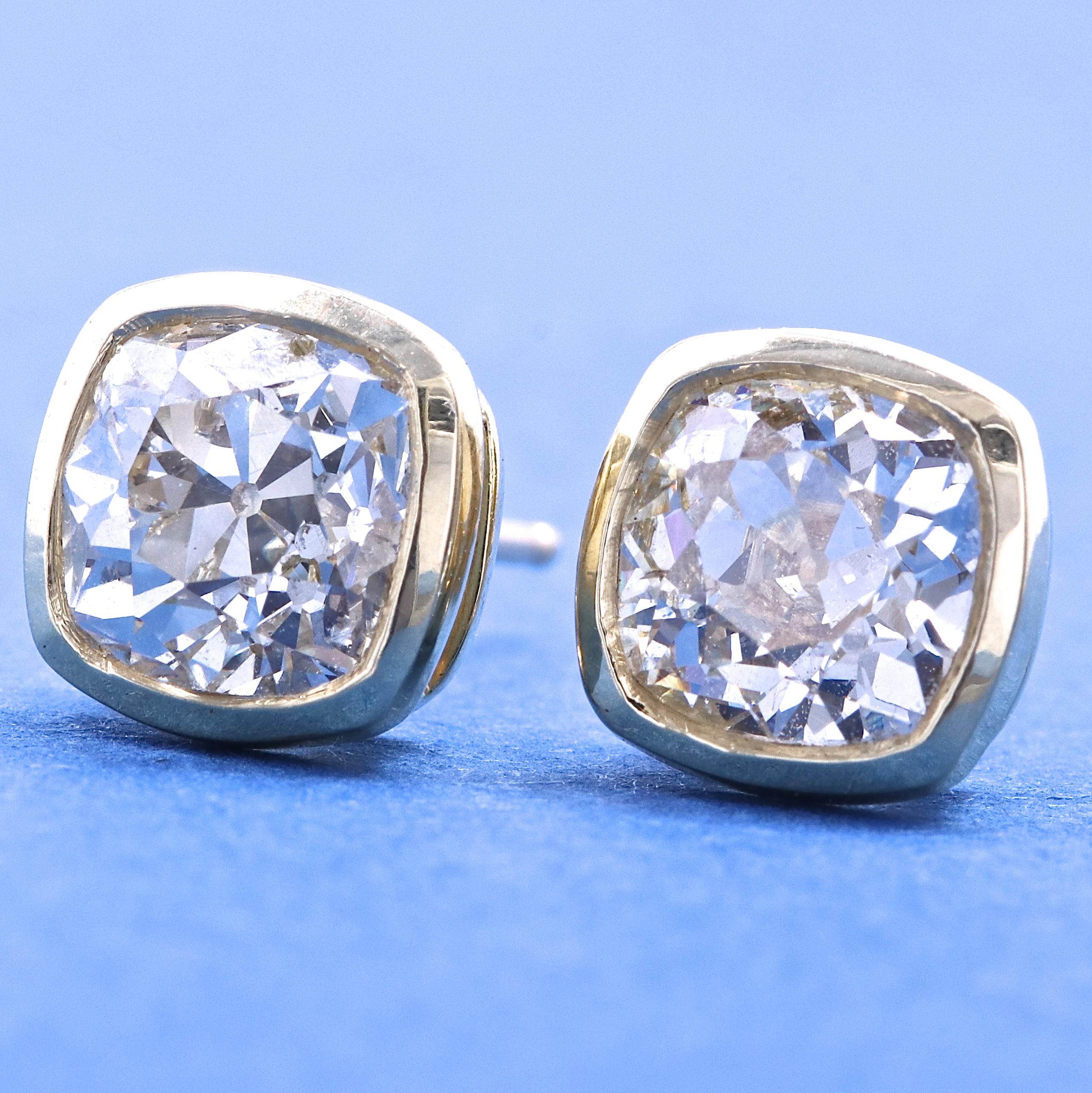 We all need a pair of great diamond studs. We've added rich 18k gold bezels to these stunning old mine cut diamonds to create studs that rock the best of old world charm and contemporary design. These diamond stud earrings feature a total of 2.31