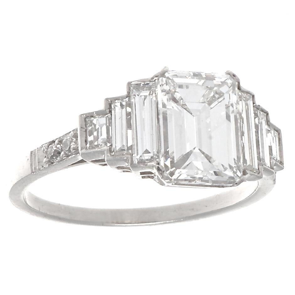 The perfect example of why emerald cut diamonds are cut for their clarity and resulting elegant appearance. This dazzling Jack Weir & Sons engagement ring features a GIA certified 1.59 carat emerald cut diamond, graded F color, VS1 clarity. The 6