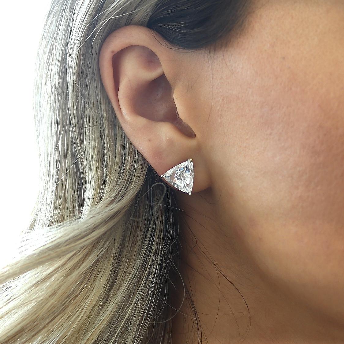 Nothing but clean lines with these stunning geometric diamond earrings. Featuring two lively trillion cut diamonds perfectly matched and  GIA certified as 2.26 carat F VS2 and  2.20 carat F SI2. In 18k yellow gold. Everyday earrings, well why