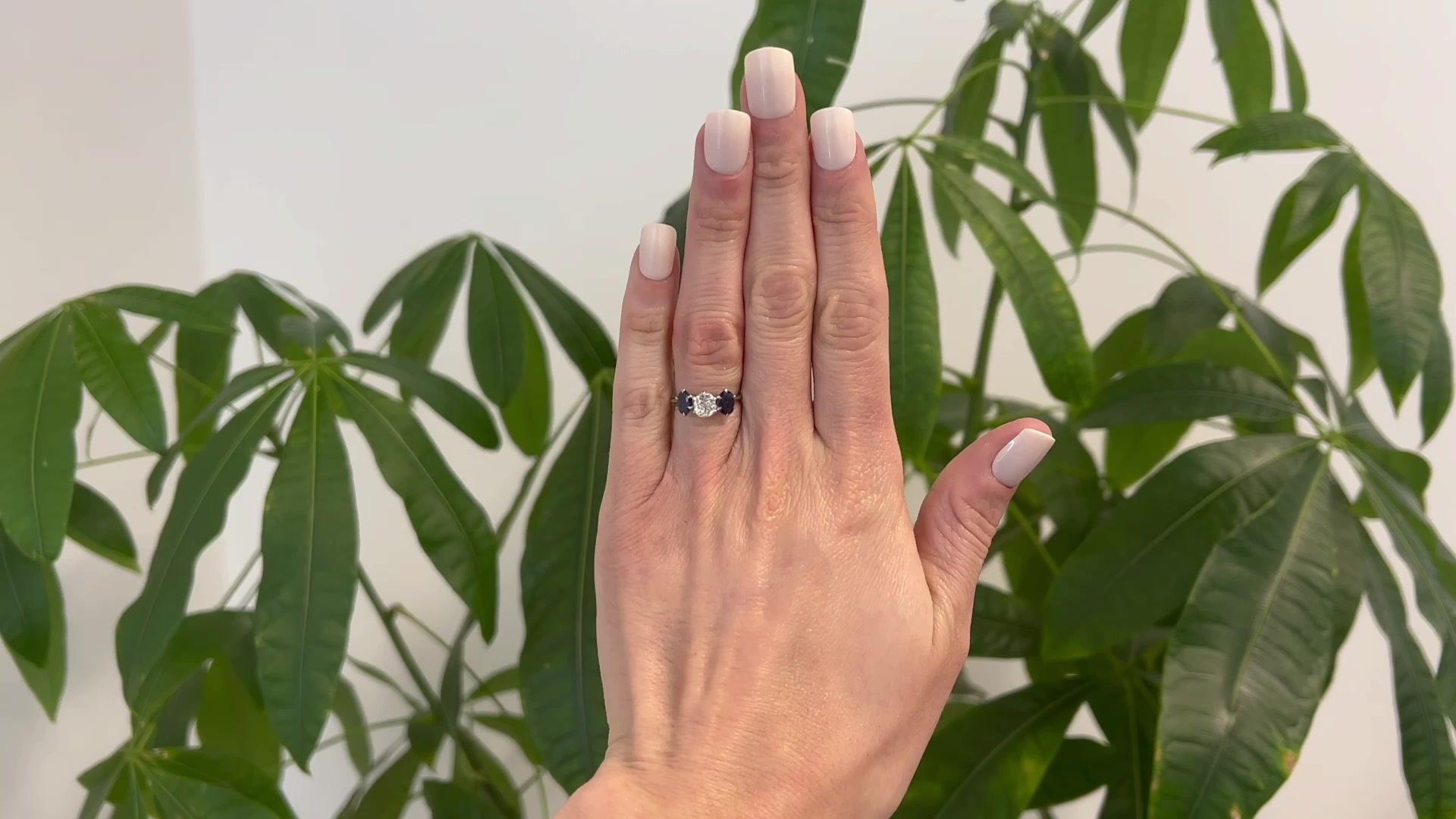 One Jack Weir & Sons Old Mine Cut Diamond Sapphire Three Stone Ring. Featuring one old mine cut diamond weighing approximately 0.65 carat, graded J color, SI2 clarity. Accented by two oval mixed cut sapphires with a total weight of approximately