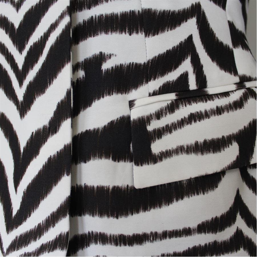 Cotton (60%) Rayon Black and white color Zebra print Automatic buttons closure Two pockets Length shoulder/hem cm 53 (20.8 inches) Shoulder length cm 39 (15.3 inches)
