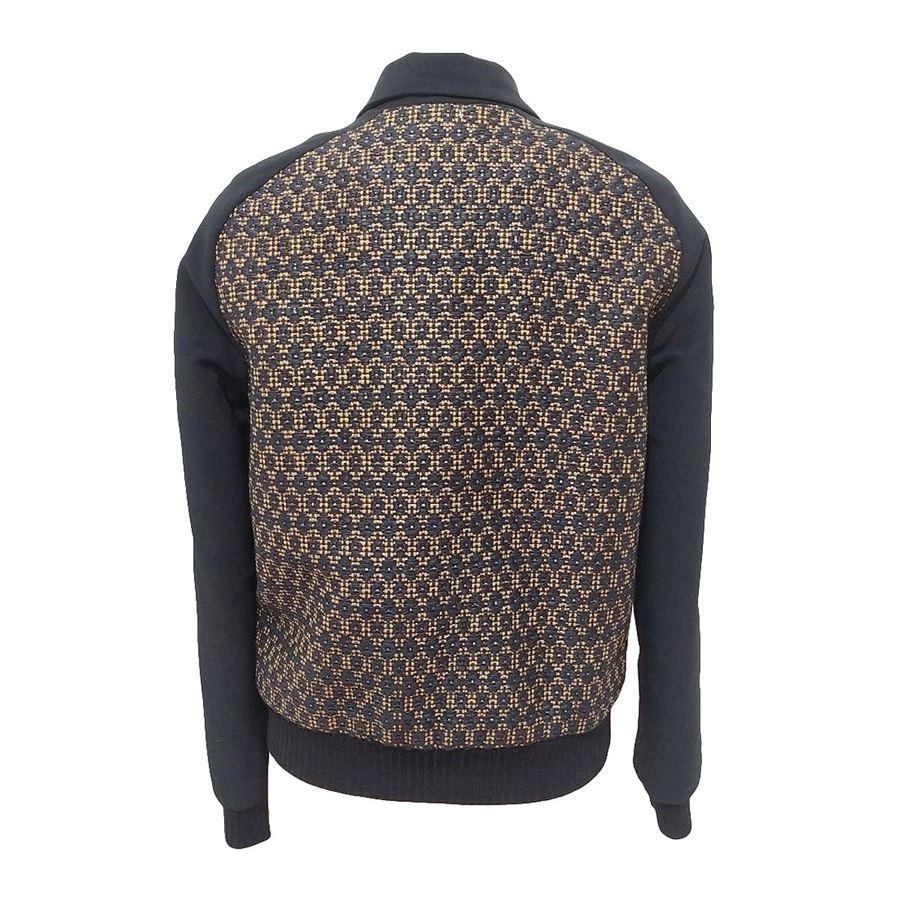 Nylon and cotton (27%) Black color Golden insert Two pockets Length shoulder/hem cm 54 (212 inches) Shoulder cm 40 (157 inches)
