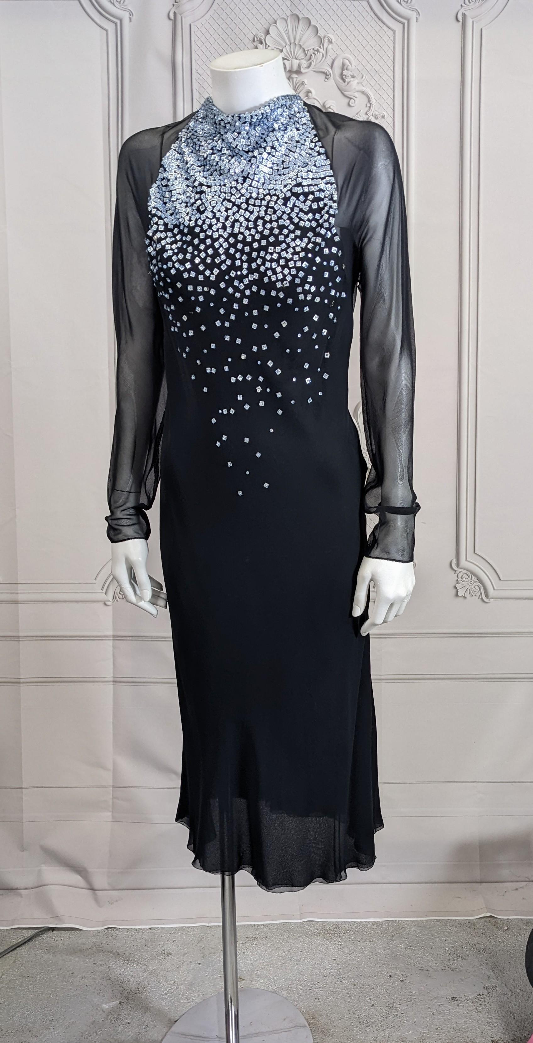 Jackie Rogers Elegant Bias Chiffon Beaded Evening Dress. 2 layers of bias black silk chiffon are used for the body of the dress with long sheer sleeves. The cowl neckline is beaded with sequins overlaid with crystals in pale blue degrading from neck