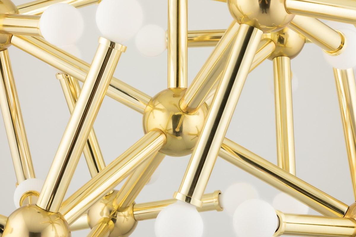 Martyn Lawrence Bullard for Corbett Lighting
The Jackstone Chandelier is inspired by the classic children's game jacks and is playful and energetic. 
Metal star shapes in vintage polished brass are capped at the end by circular glass globes. 
Light