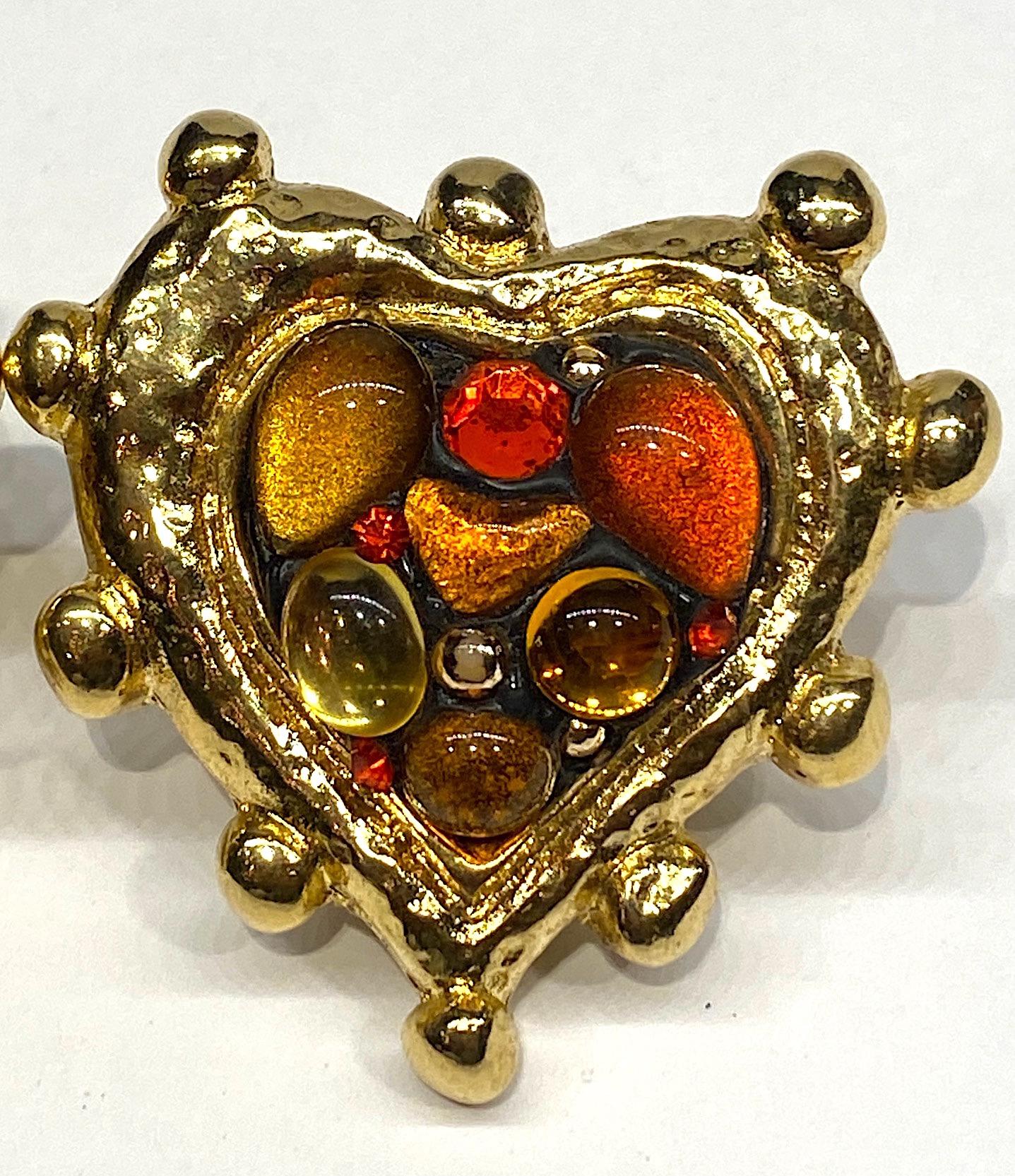 A fabulous 1980s pair of statement large heart shape earrings by French fashion jewelry designer Jacky de G of Paris. The earrings are comprised of a resin interior, for lightness, that is metal covered and gilded. The interior is set with gold and