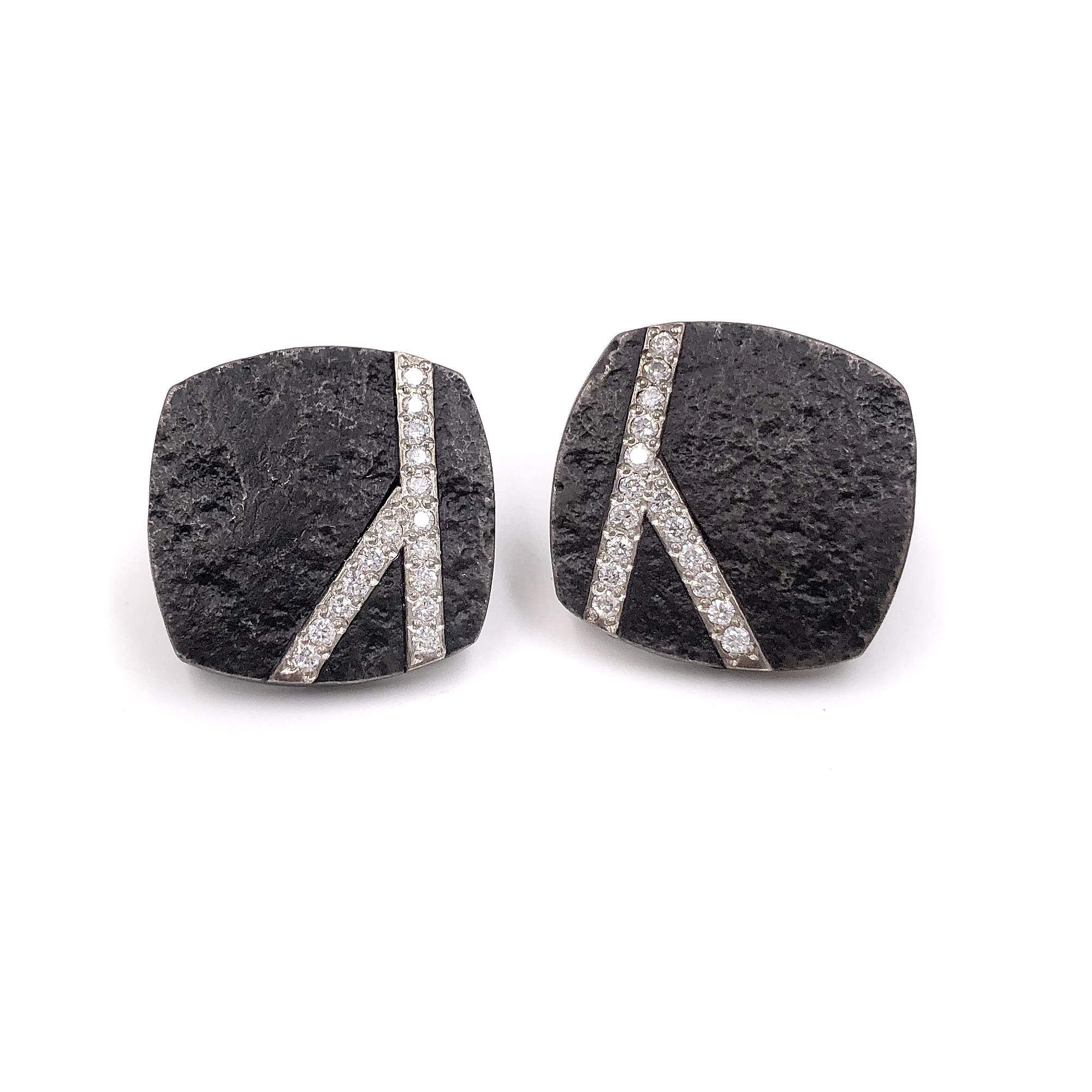 Small Carbon Cubed Earrings by award-winning jewelry artist Jaclyn Davidson hand-forged in weathered carbon steel featuring 18k white gold strips embedded with round brilliant-cut white diamonds (F/vs1). Earrings set on stamped 14k yellow gold posts