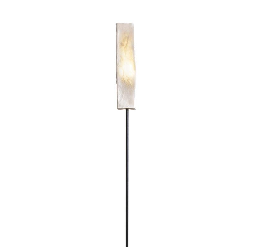 A harmonious union of traditional techniques and contemporary design aesthetic, this lamp is a sublime addition to a modern-style living room, bedroom, or study. The sleek silhouette is composed of simple, elongated forms: a tall, rectangular base