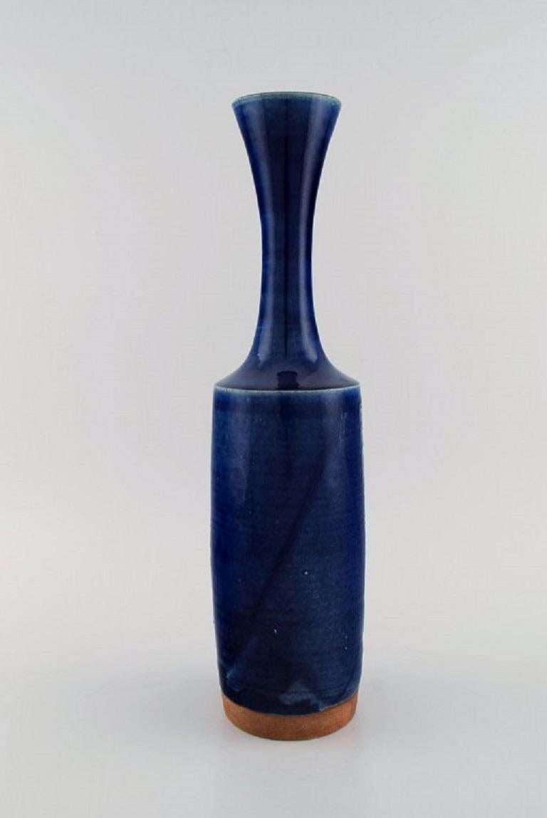 Jacob Bang (1932-2011) for Arne Bang. Large unique vase in glazed stoneware with geometric patterns. 
Beautiful glaze in shades of blue. Mid-20th century.
Measures: 39 x 10 cm.
In excellent condition.
Signed.