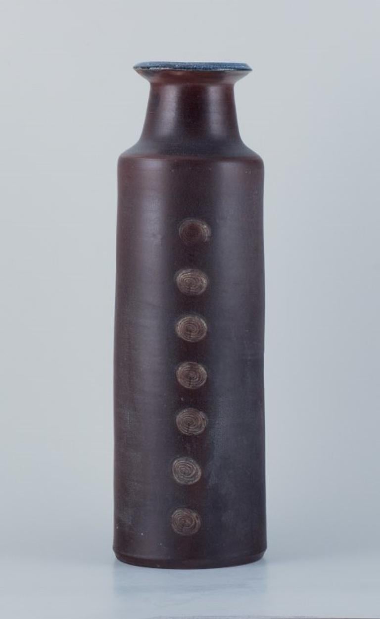 Jacob Bang (1932-2011) for Hegnetslund Lervarefabrik, Denmark.
Large ceramic floor vase in a modernist style with incised ornamentation. 
Glazed in shades of blue and brown.
1957-62.
Model: B67.
Stamped: Jacob B67
In excellent condition with minor
