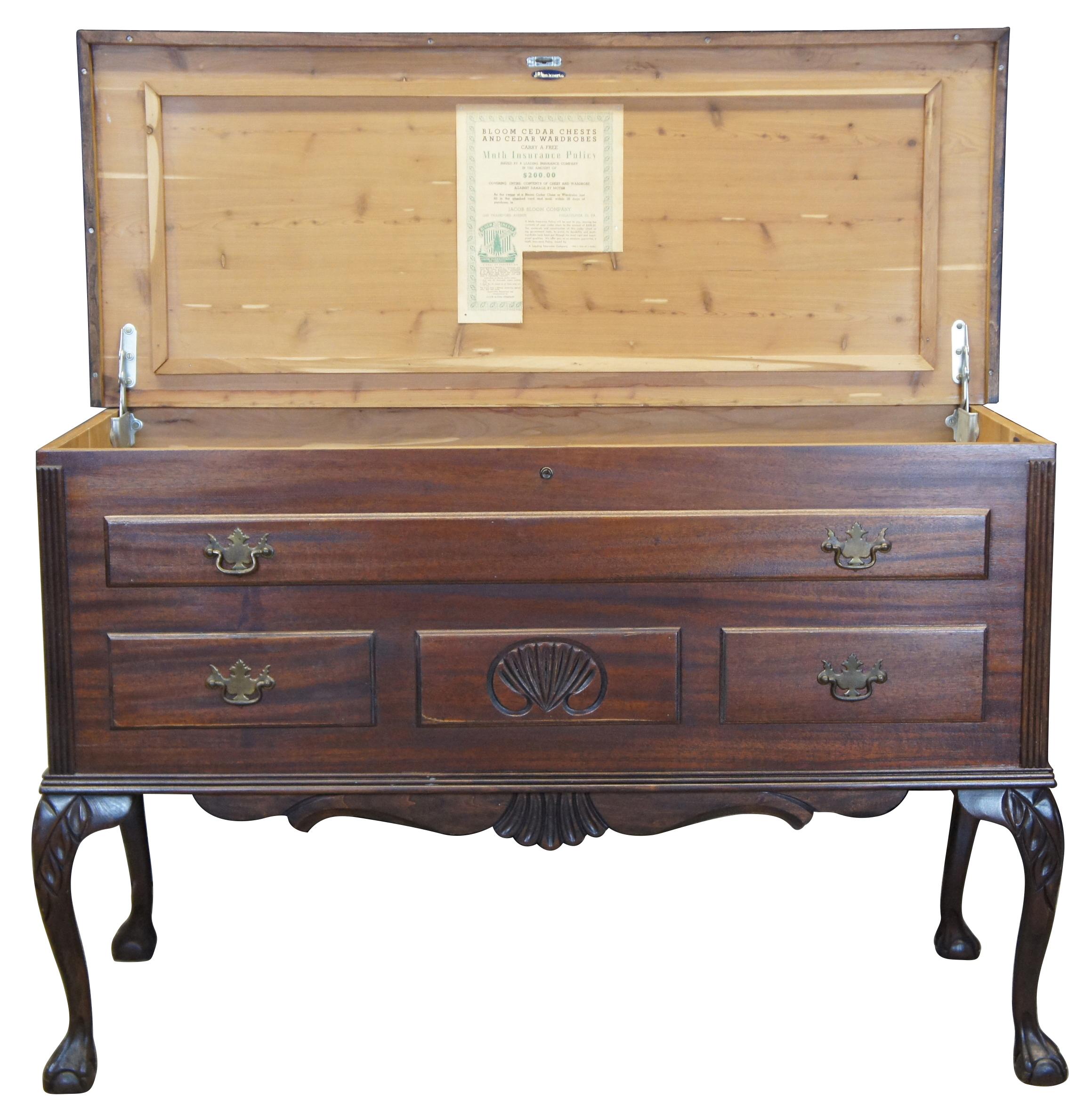 Jacob Bloom Company circa 1930s red cedar lined chest or coffer. Made from mahogany with Chippendale styling. Features three false drawers along the front, scalloped carvings, a serpentine crest and cabriole legs leading to ball and claw feet. This