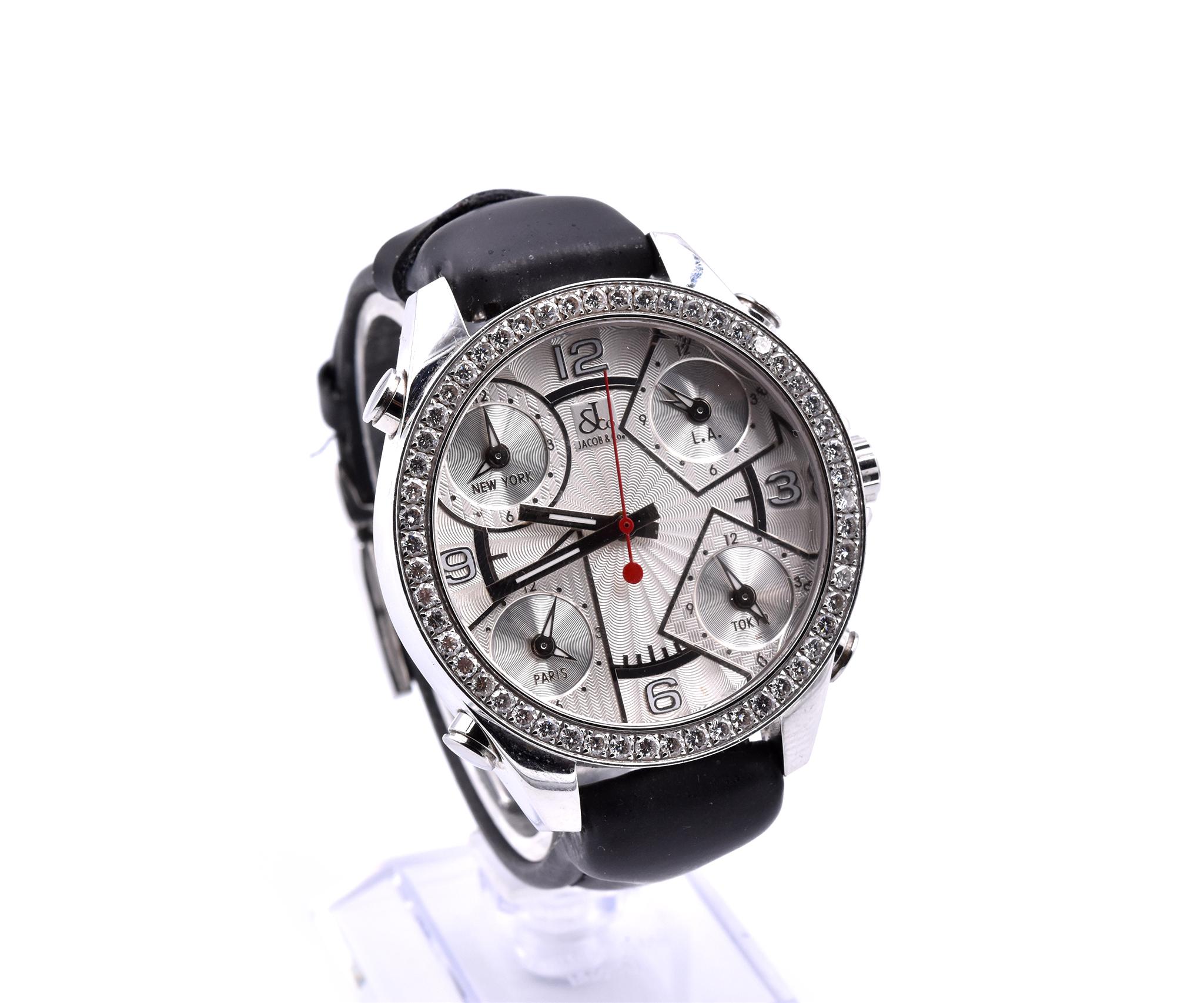 Movement: quartz
Function: hours, minutes, seconds, date, five-time zones
Case: stainless steel round 47mm case with diamond bezel, five pull/push crowns, sapphire protective crystal
Band: black leather band with deployment buckle
Dial: Silver dial