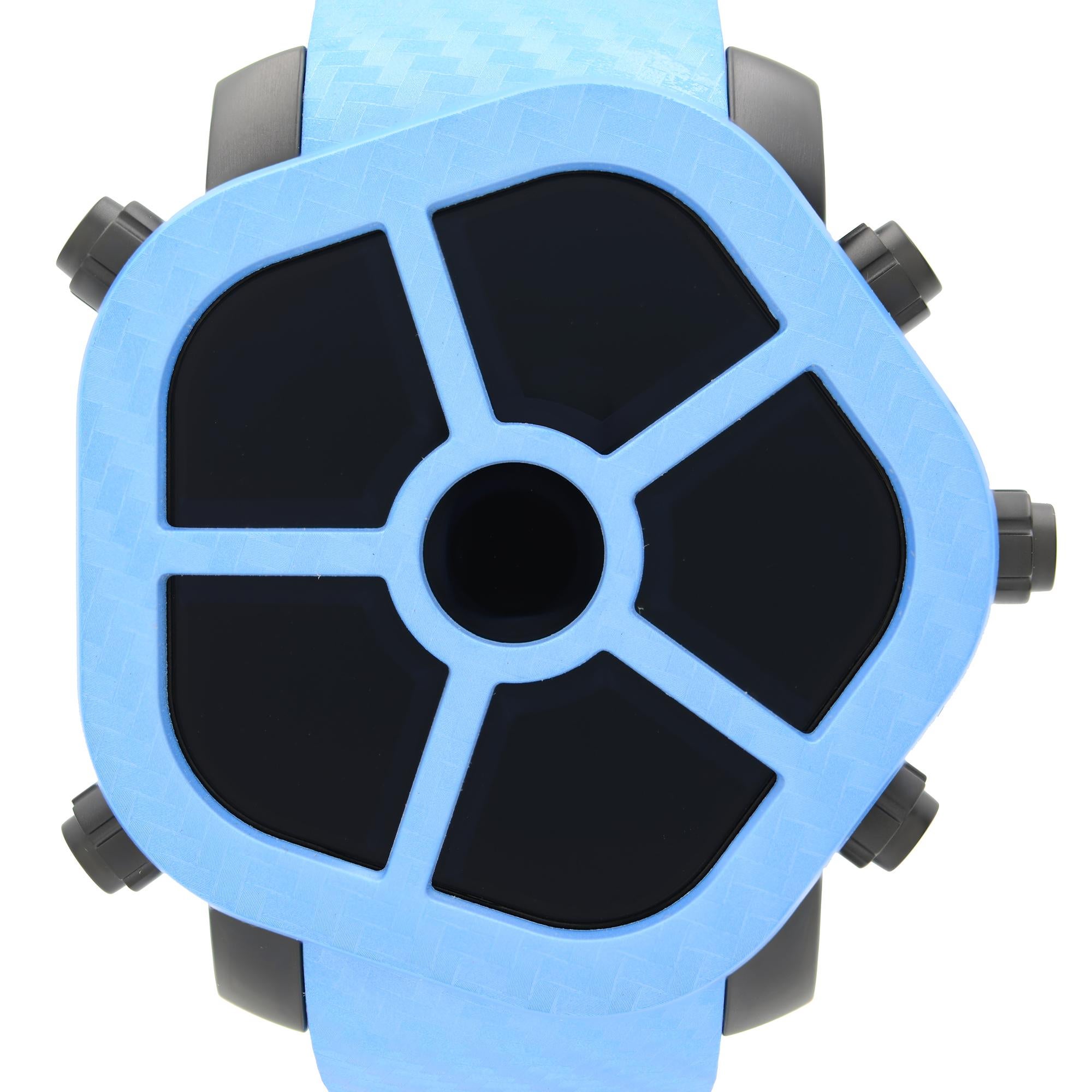 Display Model Jacob & Co. Ghost 5-Time Zone Carbon Bezel Blue Men's Watch GH100.11.NS.MC.ANL4D. This Beautiful Timepiece Features: Stainless Steel Case with a Black PVD Coating, Blue Vulcanized Rubber Strap, Interchangeable Carbon Fiber Bezel