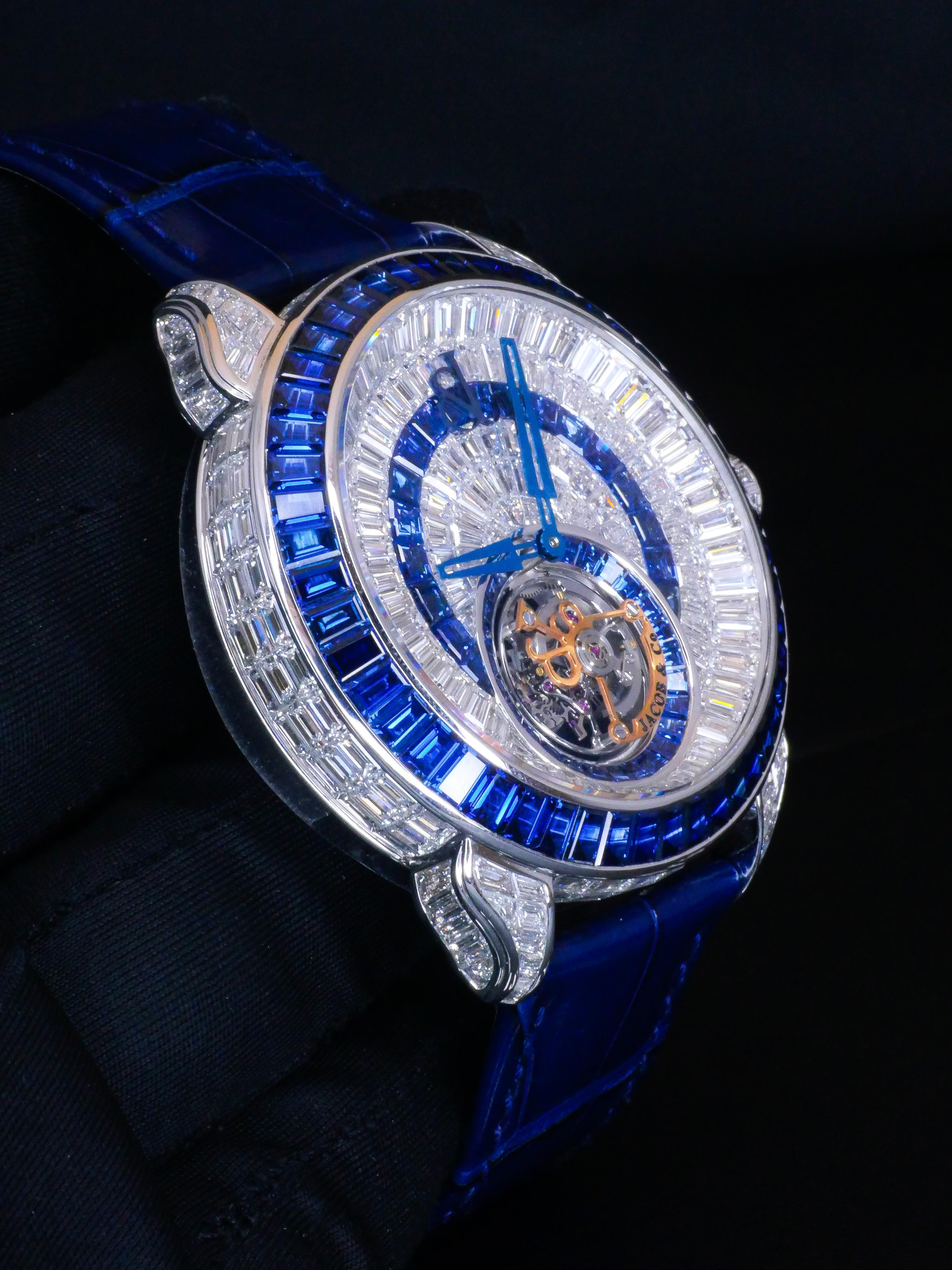 The Palatial Opera Flying Tourbillon is a delightful fusion of time and
light. An exquisite masterpiece of horology and gem setting, each
captivating timepiece requires 18 months to produce. Constructed
to resemble an amphitheater, every superbly