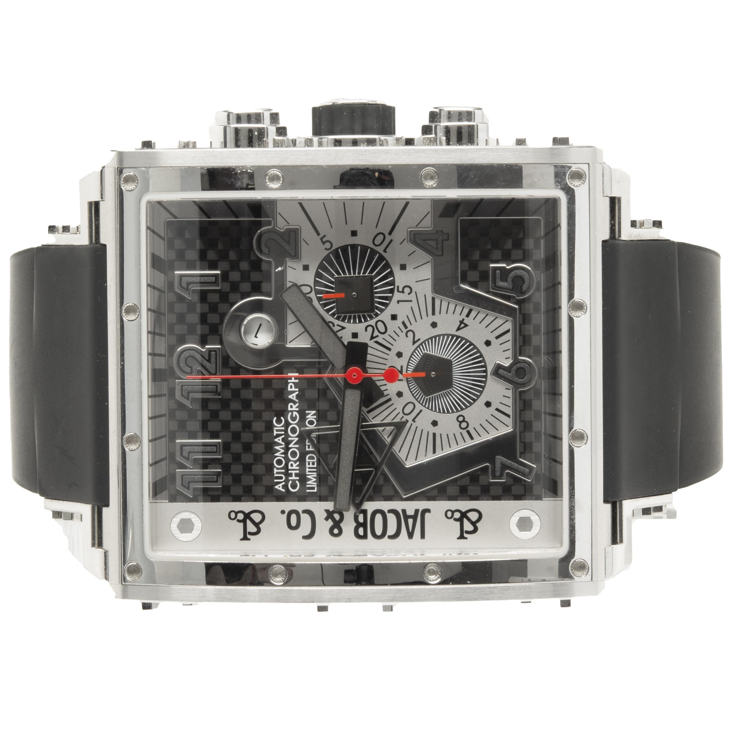 Movement: quartz
Function: hours, minutes, seconds, date, chronograph
Case: stainless steel square 51.2 x 46.5mm case, pull/push crowns, sapphire protective crystal
Band: black rubber strap, integrated clasp
Dial: black carbon chronograph
Reference