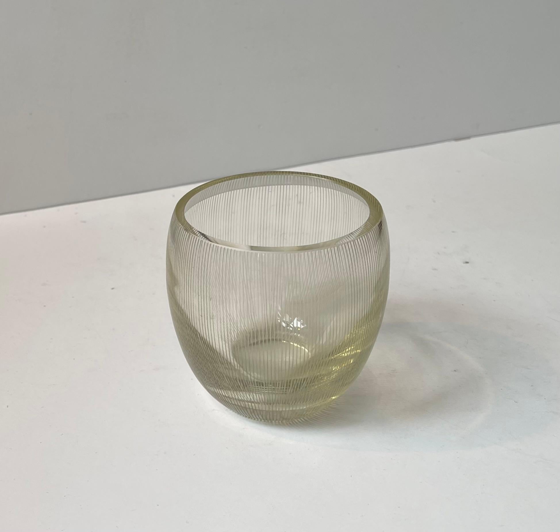 Exceptionally rare vase by Jacob E. Bang. Every piece in this series was hand-engraved making them individually unique. Besides the vertical etchings it has a light yellow hue to the glass. Some of these pieces were made in collaboration with Carl