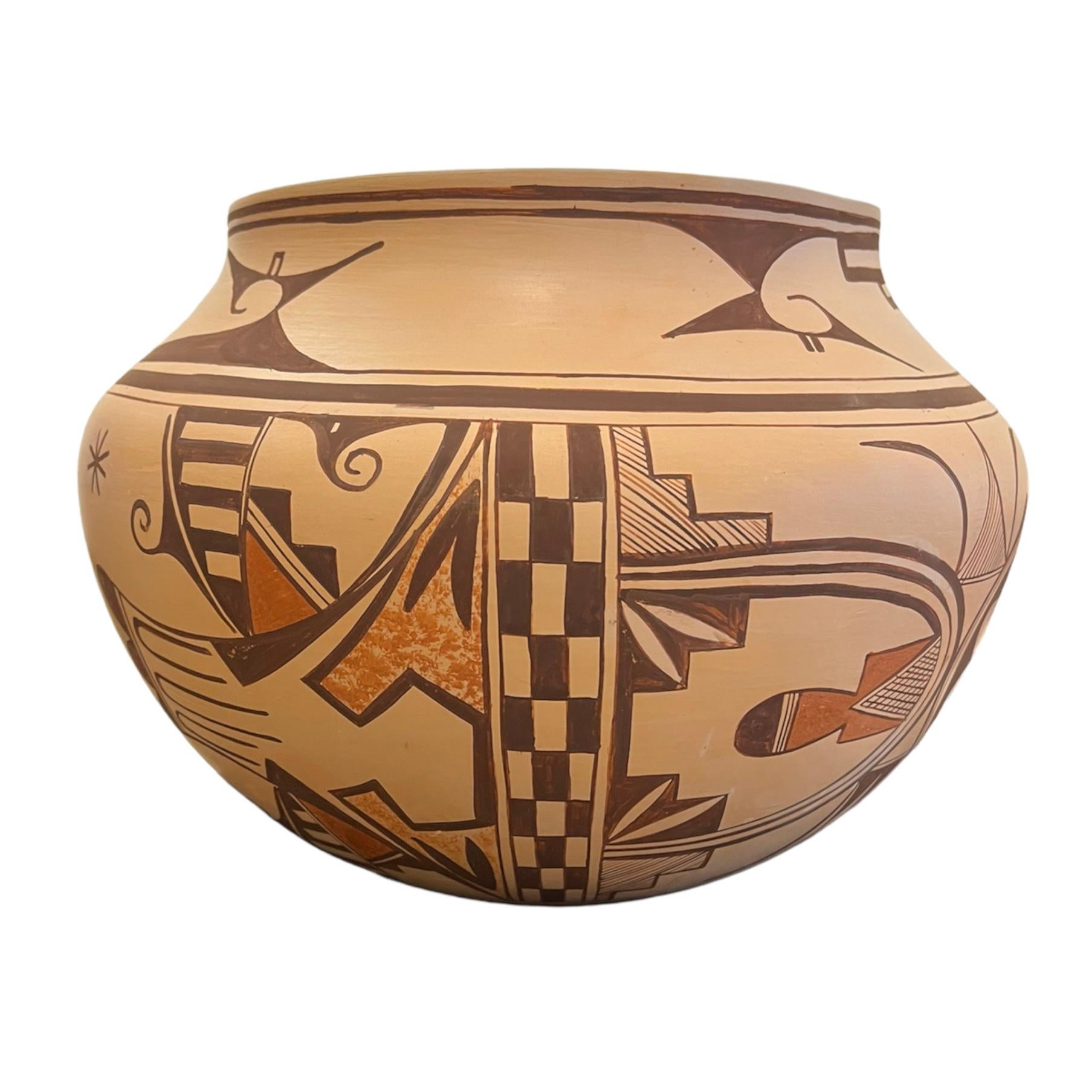 2023
Coil built vessel, Hopi slip with tansy mustard and hematite glaze, electric kiln fired.

11”x 15” x 15”
Born in Santa Fe, New Mexico, Jacob Thomas Frye is a fourth-generation potter and painter from Tesuque Pueblo. Frye’s passion for art and
