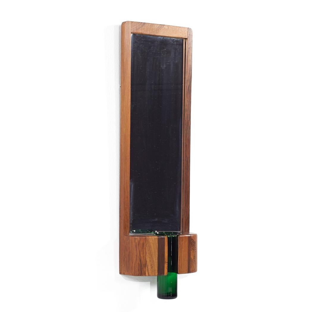 Jacob Hermann for Randers Møbelfabrik Mid Century Danish Rosewood Wall Mirror with Green Glass Vase

This mirror and vase measures: 7.75 wide x 3.25 deep x 23.5 inches high
The mirror with the vase measures 25.75 inches high

All pieces of furniture