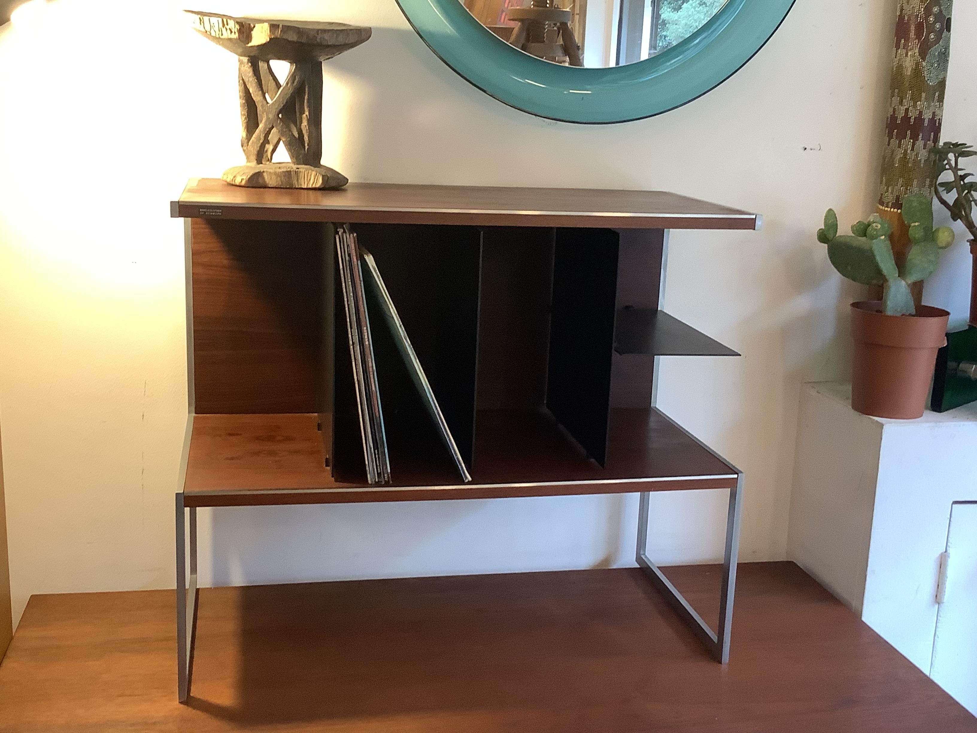 Stunning mid century rosewood and steel hi fi storage cabinet by Jacob Jensen for Bang and Olufsen. Made in Denmark in the 1970s. The labels says 'Bang and Olufsen of Denmark'. It has black metal dividers to keep your vinyl collection in order.
This