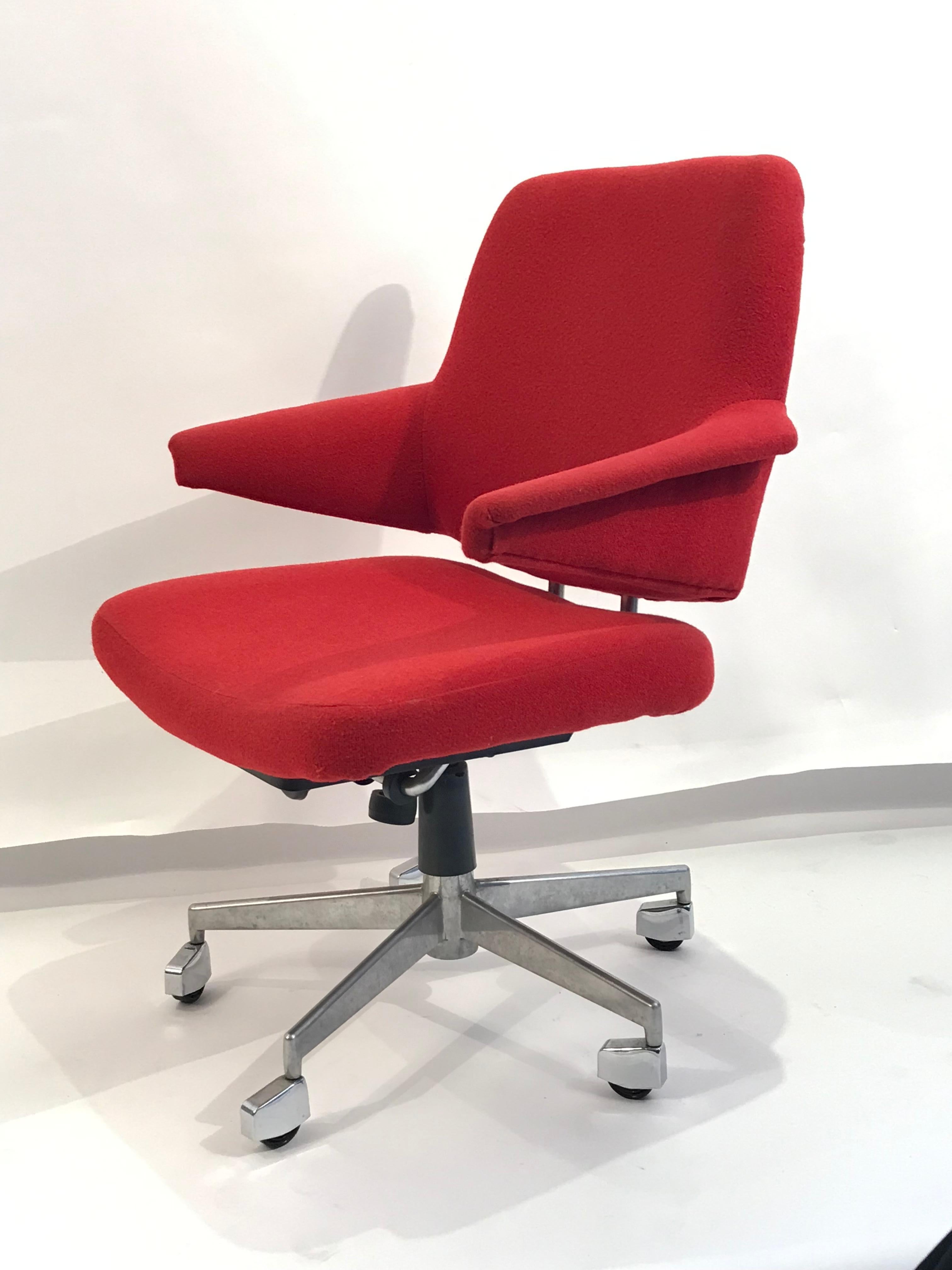 Vintage chair built in the 1960s with sleek lines and multi adjustable design. Solid as a tank with wheels and a swivel base, independently reclining back, adjustable tension and more. Cherry red fabric. Super attractive and comfortable. Desk or