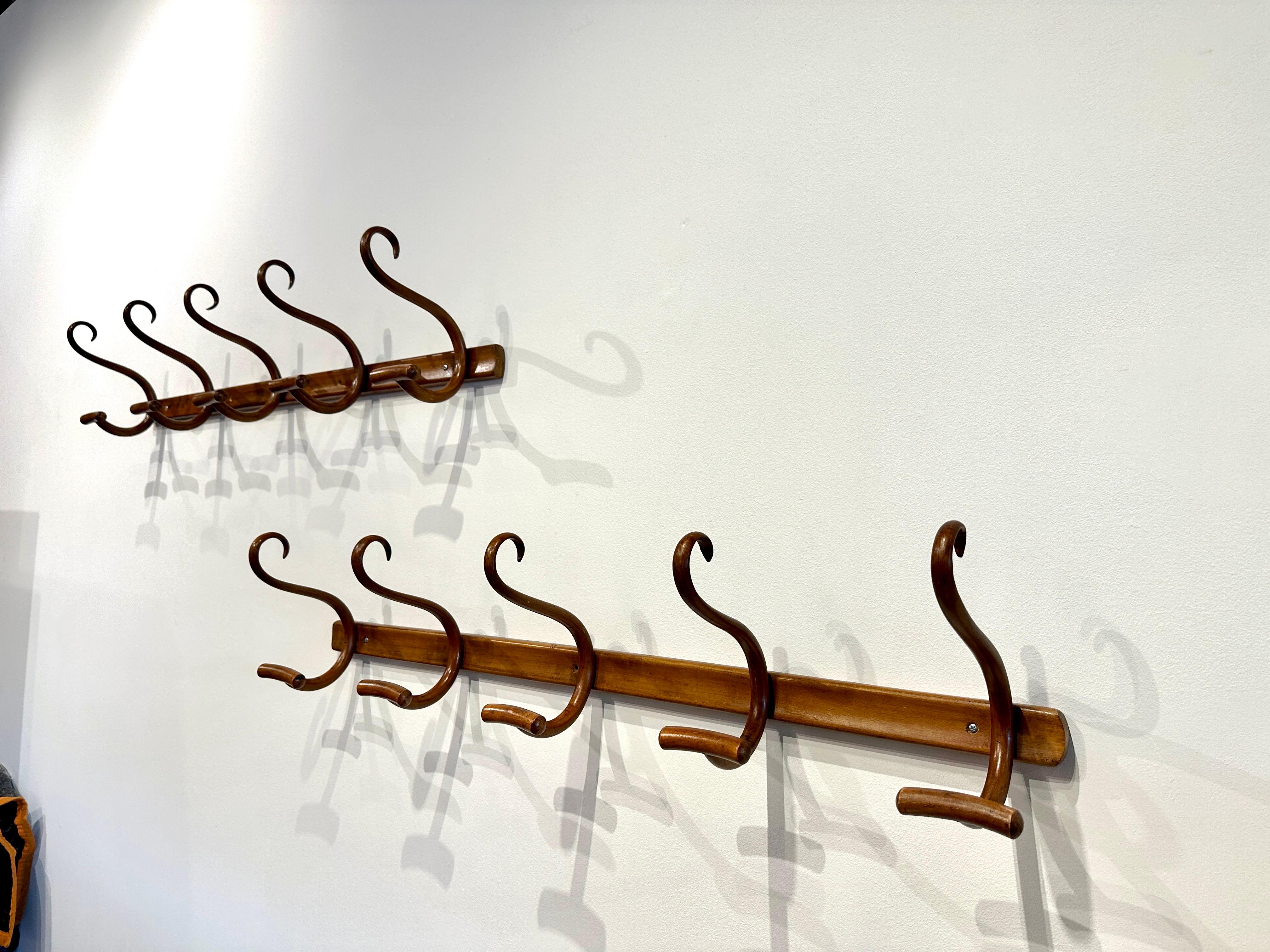 Two available - exceptional secessionist bent wood coat rack with 5 hooks, designed and produced by Jacob and Josef Kohn, 1890's. Labels to verso and condition is amazing for their age.  THIS ITEM IS LOCATED AND WILL SHIP FROM OUR EAST HAMPTON, NY