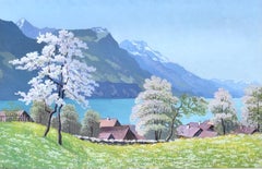 Spring landscape by the lake with a view of the Alps