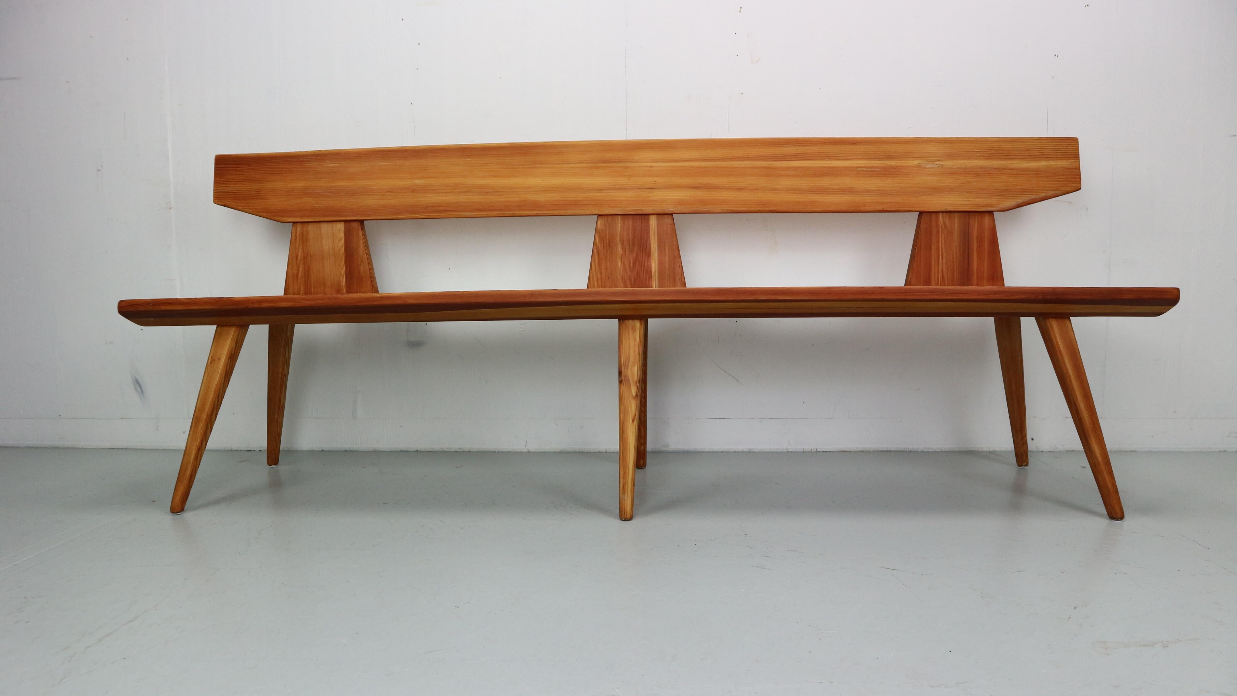 Handcrafted pine wooden bench by Jacob Kielland Brandt, 1960s for Christiansen Denmark.
This is a recognizable Scandinavian Modern period piece by it's specific shape, elegant curves and construction method.
The designer won the Cabinetmaker Guild