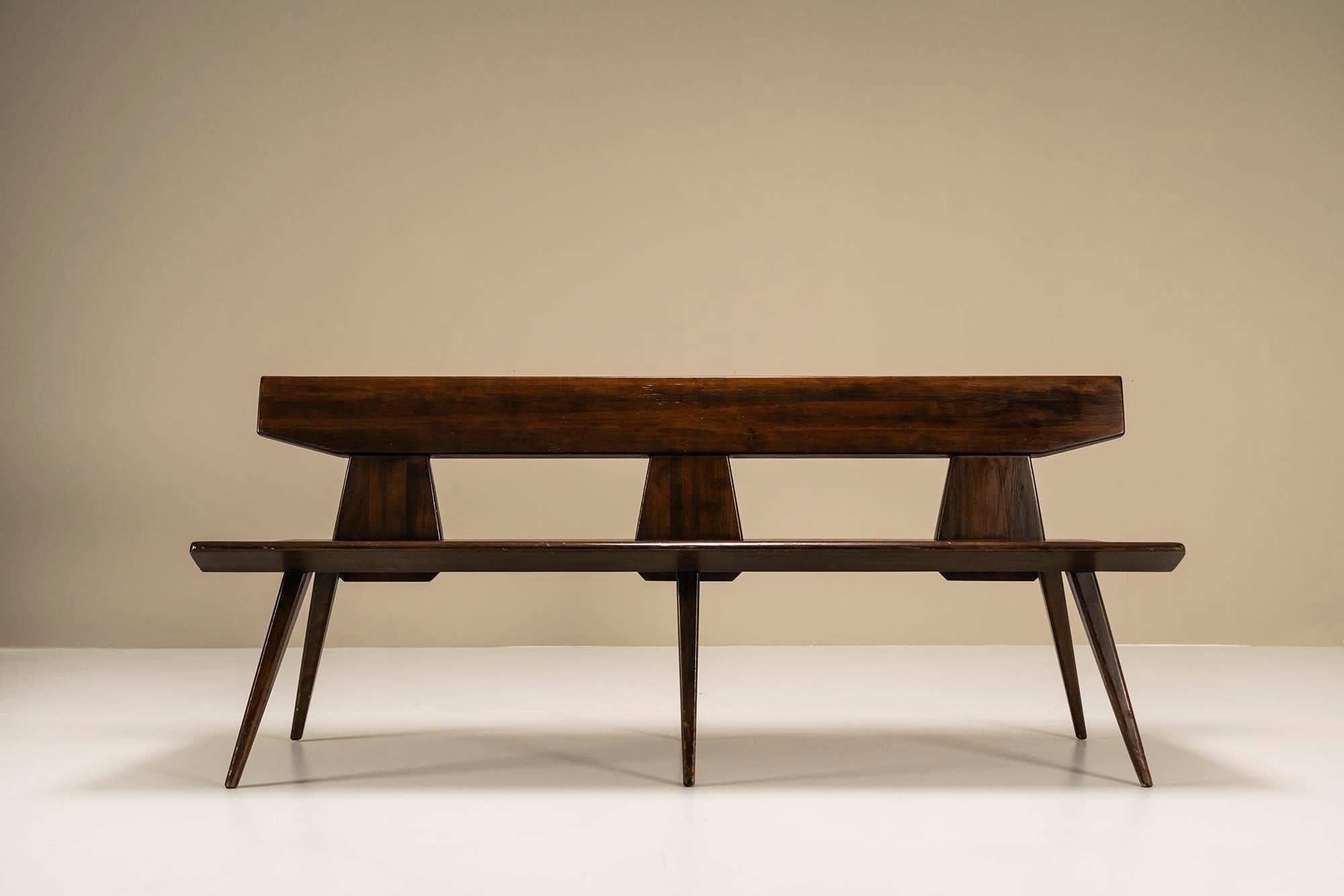 This solid dark stained pine 1960s bench is best described as a minimalist work by the Danish designer Jacob Kielland- Brandt. Its geometrical shape and form clearly evoke a pure visual response. We can also speak of a very honest design that was