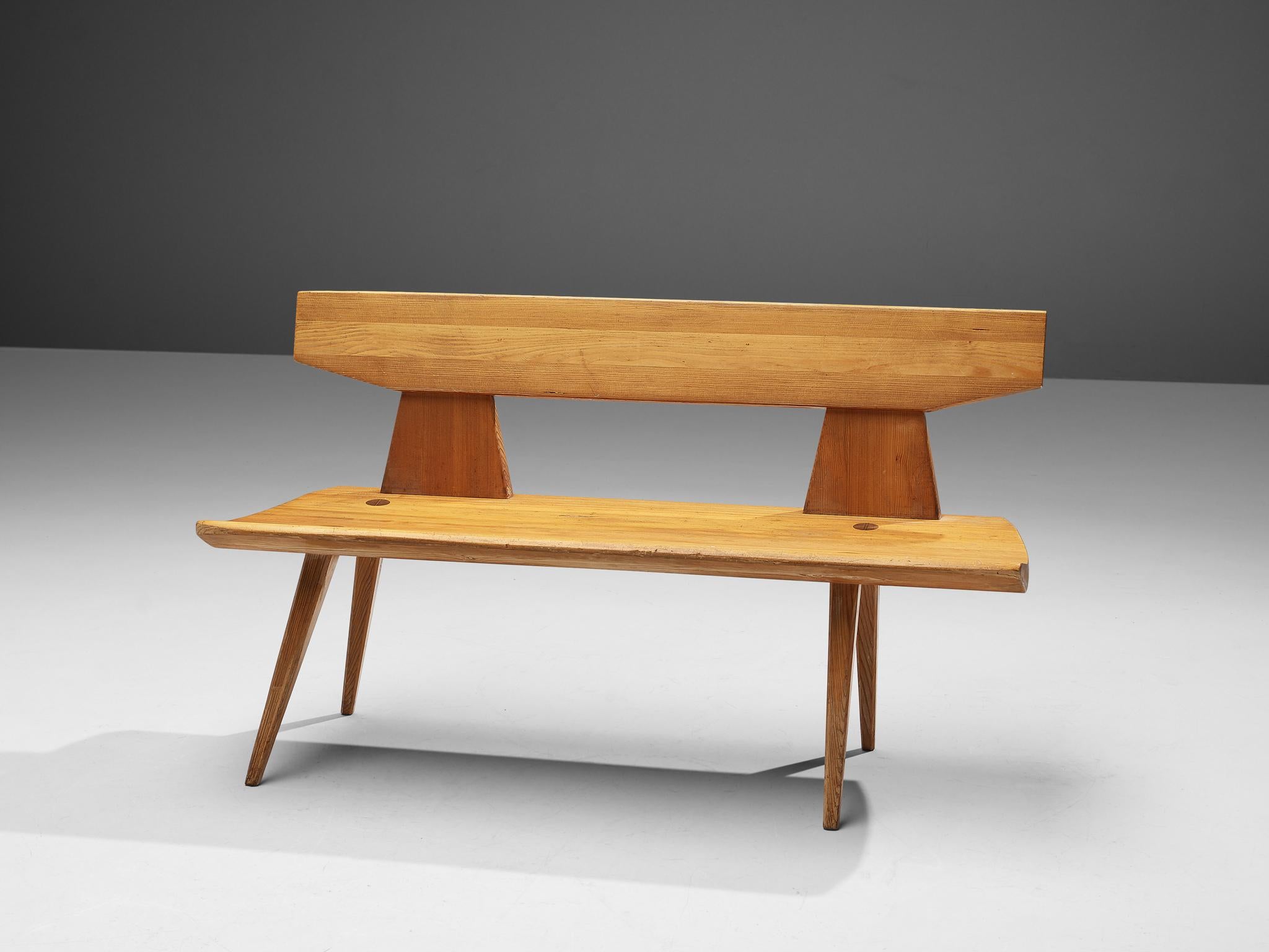 Jacob Kielland-Brandt, bench, pine, Denmark, 1960s

This wooden bench is designed by Jacob Kielland Brandt. This piece features tapered and tilted legs that go 'through' the seat, showing the wooden connection on top. Interesting detail is the way