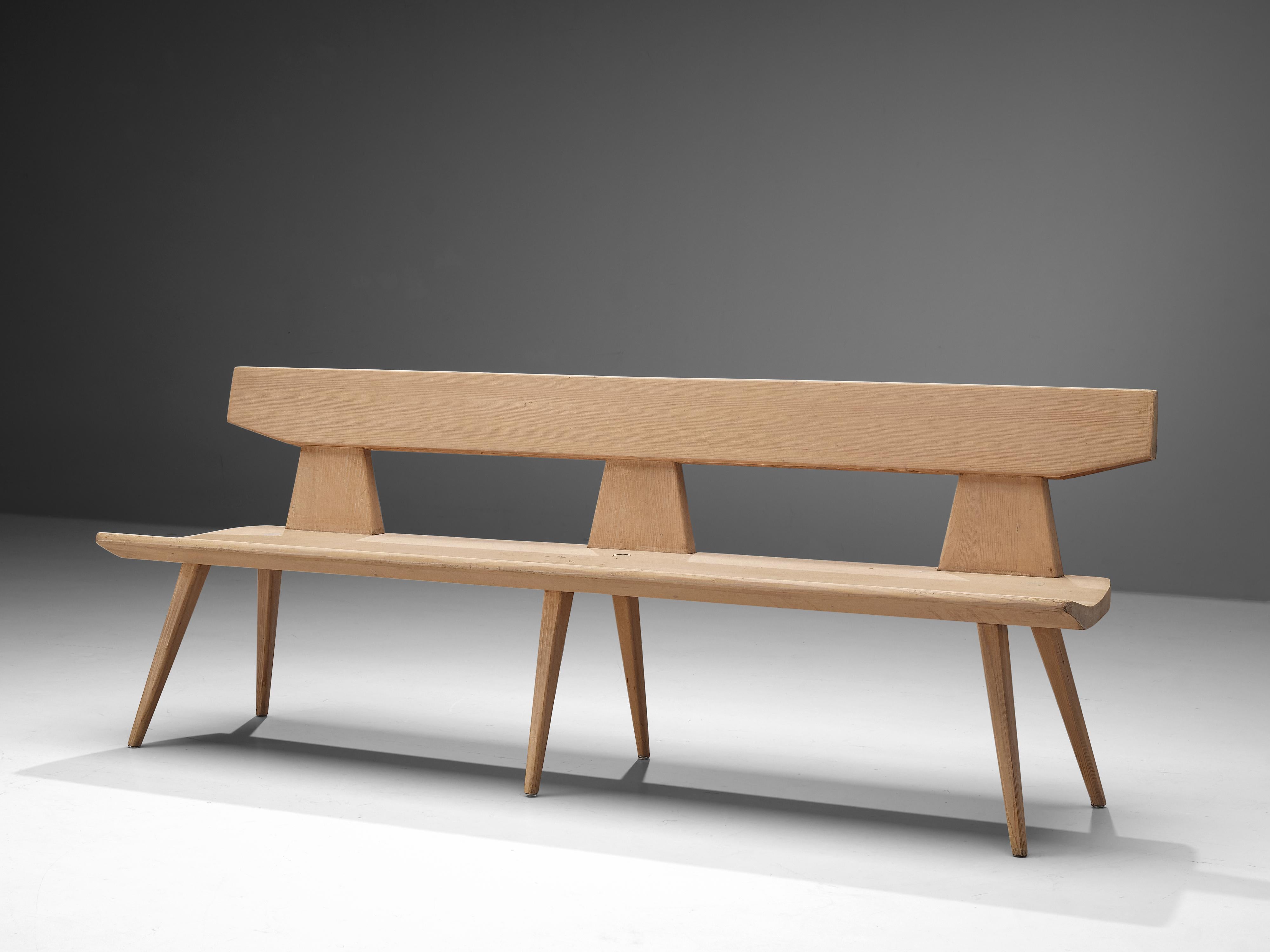 Jacob Kielland-Brandt, bench, solid pine, Denmark, 1960s.

This wooden bench is designed by Jacob Kielland-Brandt. This piece features tapered and tilted legs that go 'through' the seat, resulting in a visually interesting feature. The construction