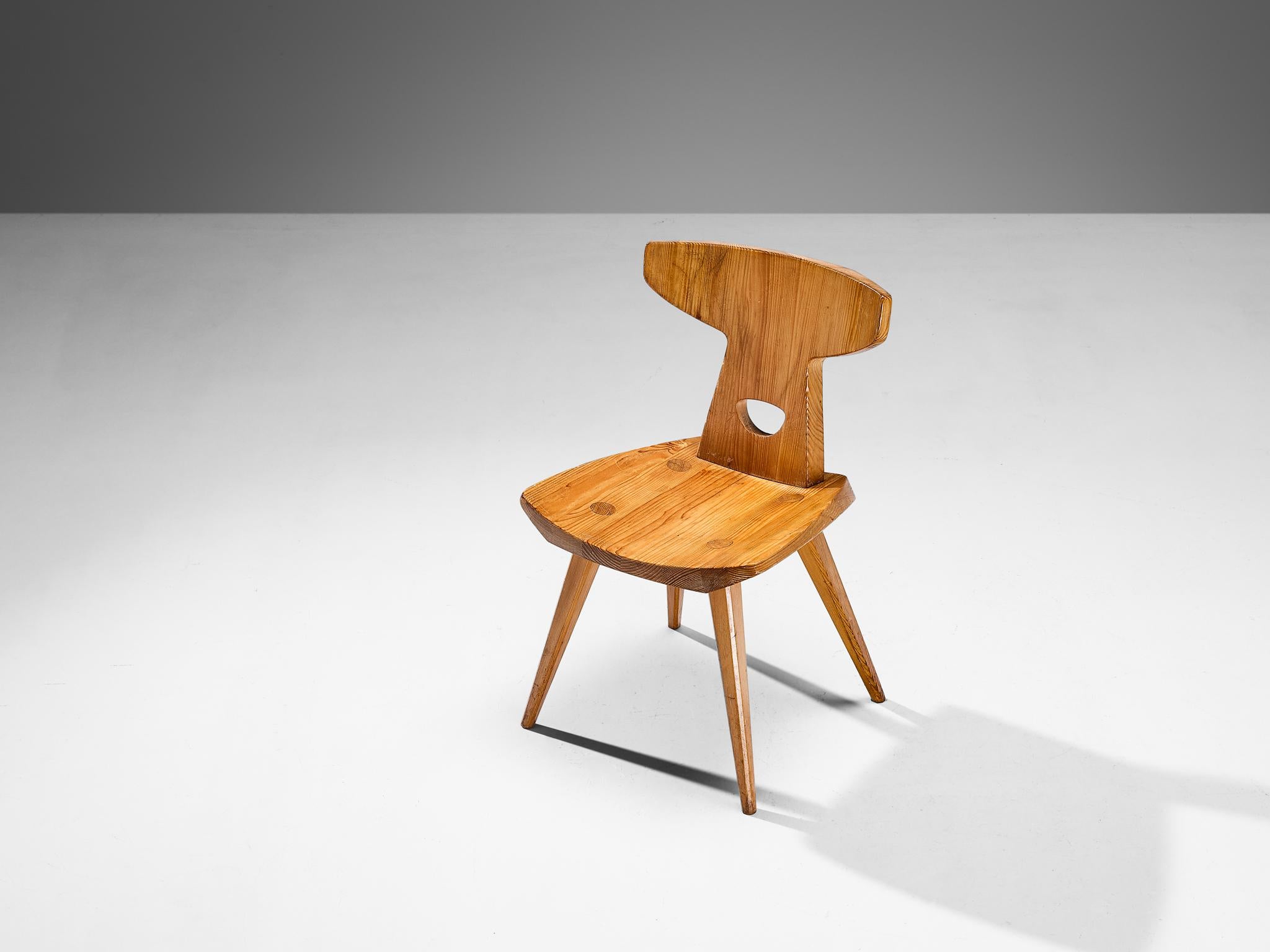Jacob Kielland-Brandt, dining chair, solid pine, Denmark, 1960s

This remarkable chair is designed by Danish designer Jacob Kielland-Brandt in the 1960s. It has a strong expression, due to the sleek design and beautiful detailing. For instance the