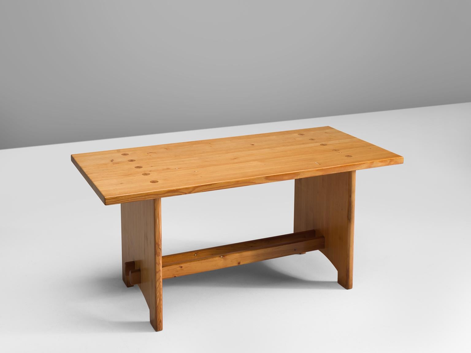 Jacob Kielland-Brandt, dining table, solid pine, Denmark, 1960s.

This remarkable table holds a strong expression and this organic shaped design is in well contrast with the solid high tapered legs which provides an open elegant look. We also have