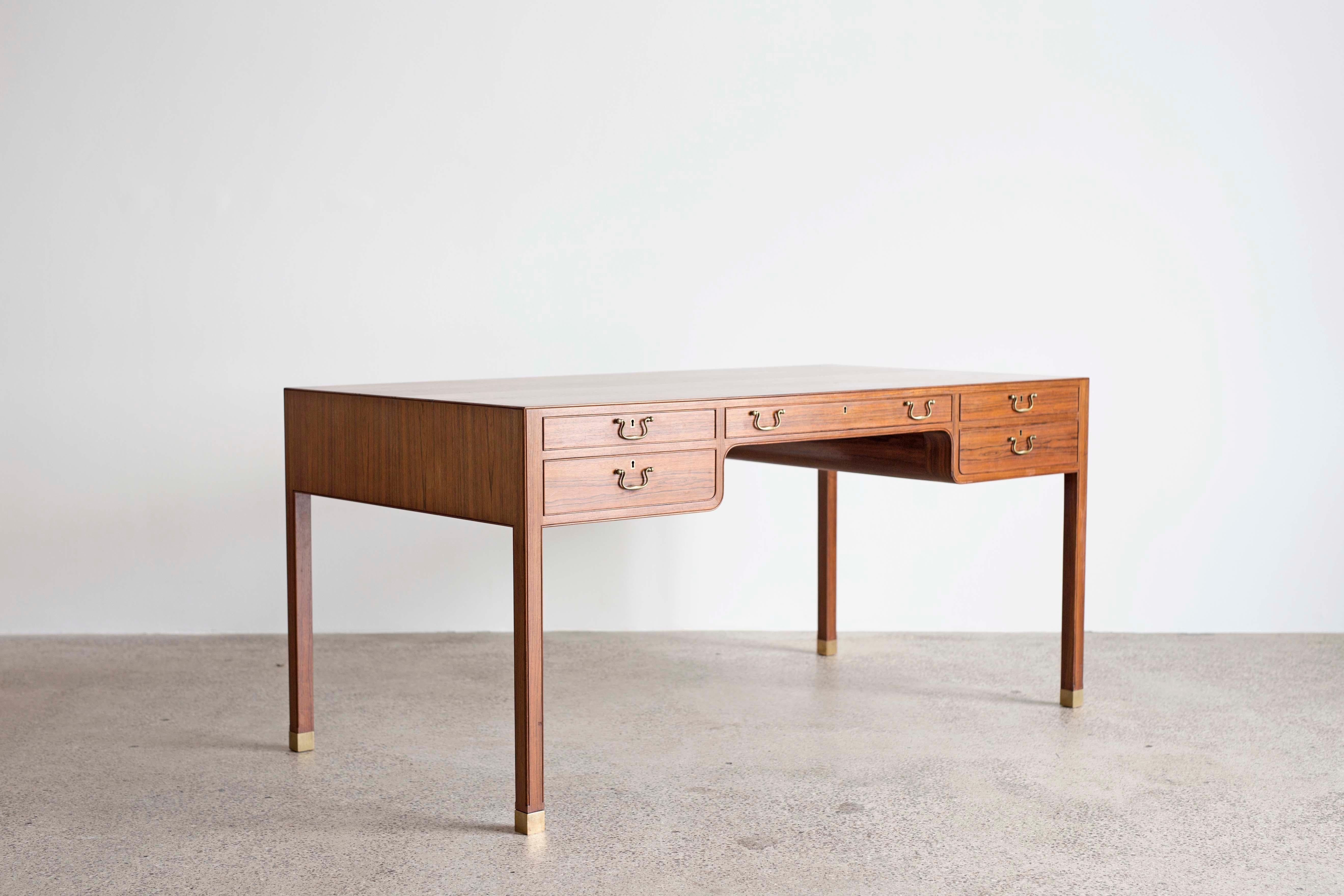 A freestanding Jacob Kjaer desk of Brazilian rosewood with brass details.
Designed and executed app. 1950 by cabinetmaker Jacob Kjaer, Denmark.