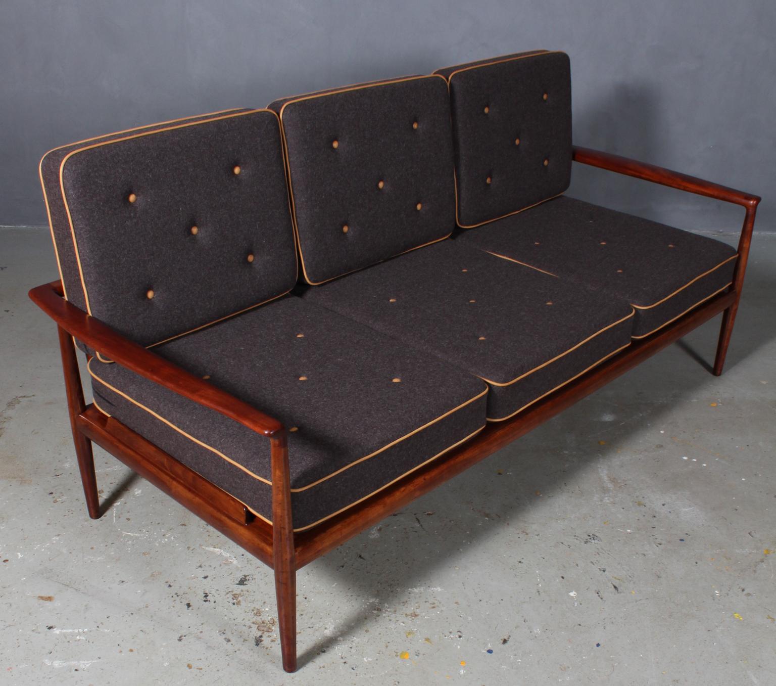 Jacob Kjær three-seat sofa with deep seats. New upholstered with 100 % New Zealand wool and vintage aniline tubing and buttons.

Frame of mahogany.

Made by Jacob Kjær in the 1940s, probably unique.