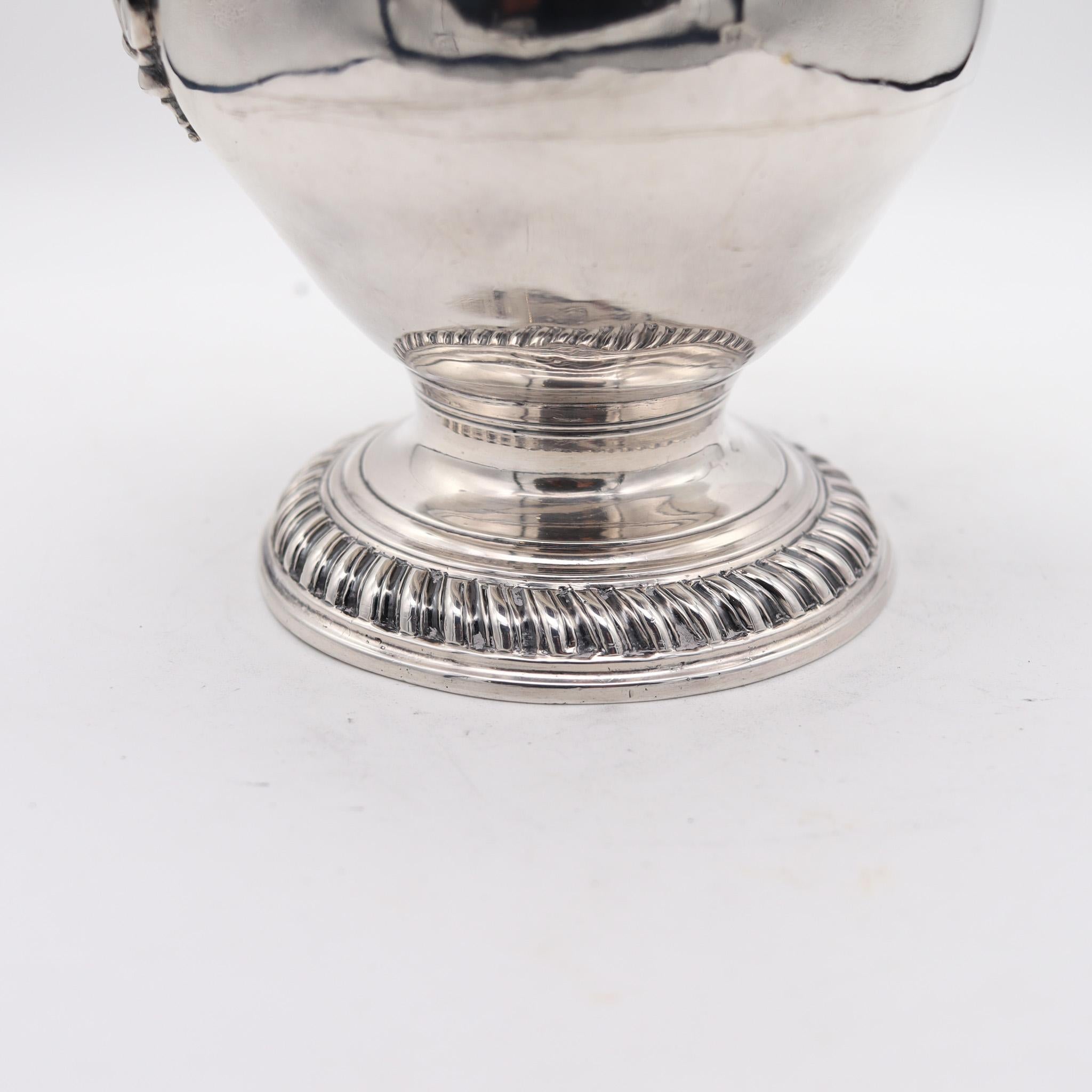 Coffee hot water pot designed in London by Jacob Marsh.

Very rare and important coffee and hot water pot of baluster form on circular spreading foot, created in the city of London in England by the silversmith Jacob Marsh. This beautiful and