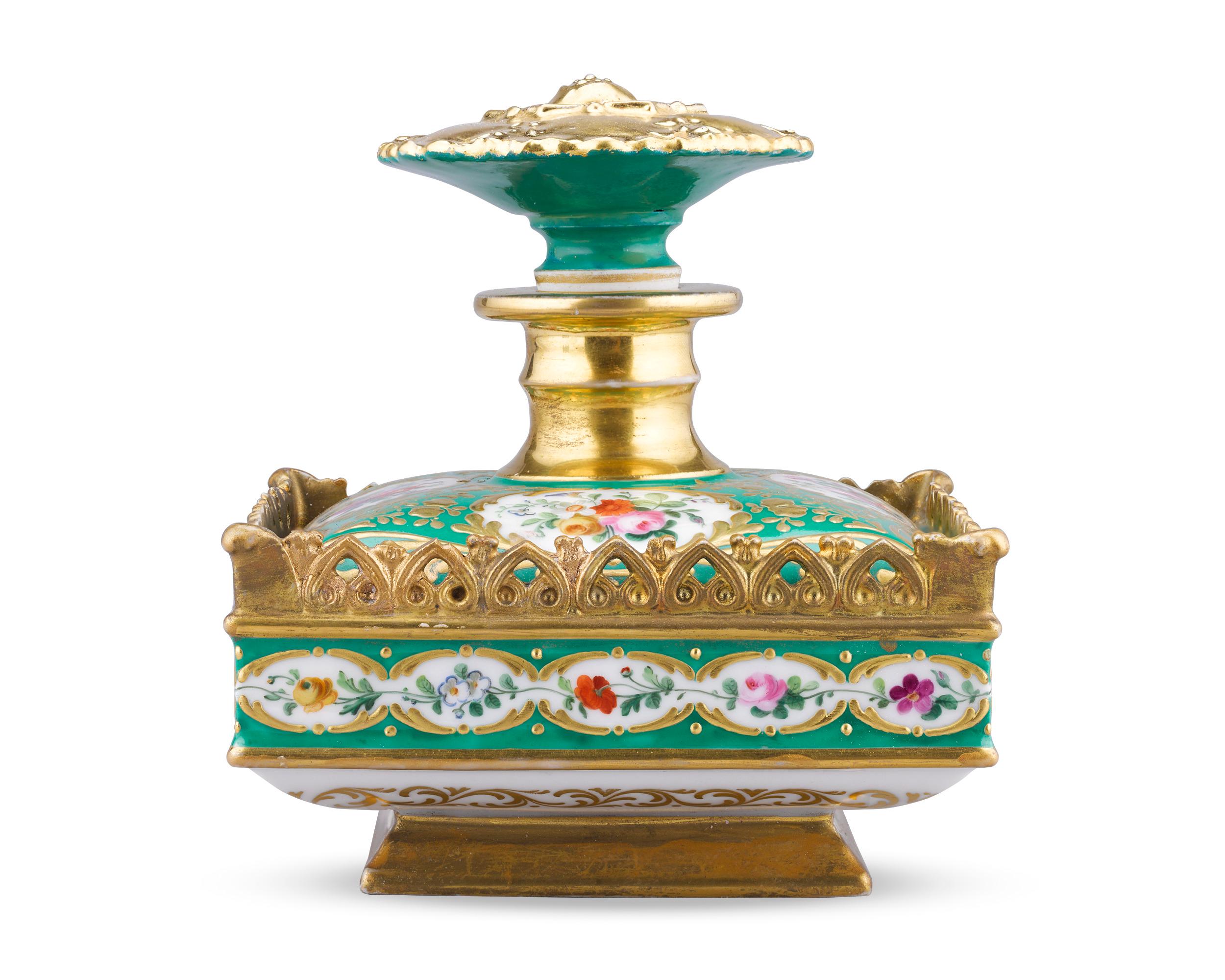 Diminutive yet ornate, this porcelain perfume was created by Jacob Petit, one of the most important and well-known makers of French porcelain. Its green ground is lavishly decorated with hand-painted flowers and gilt accents, demonstrating Petit's