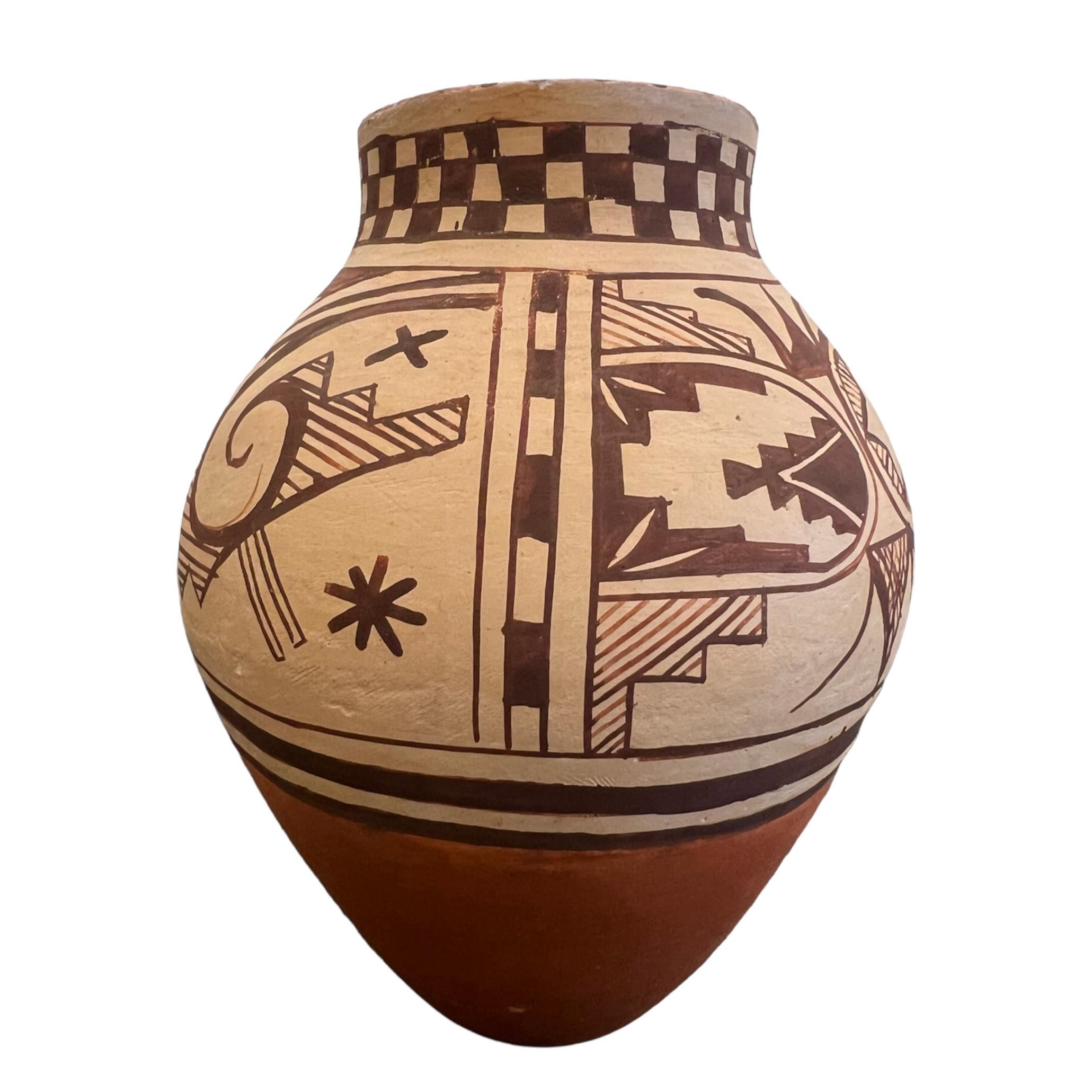 $750
A collaborative work by Jacob and Kelly Frye. Vase has a Hopi slip with hand painting in a  tansy mustard glaze.  

6”x 5”x 5”

Born in Santa Fe, New Mexico, Jacob Thomas Frye is a fourth-generation potter and painter from Tesuque Pueblo.