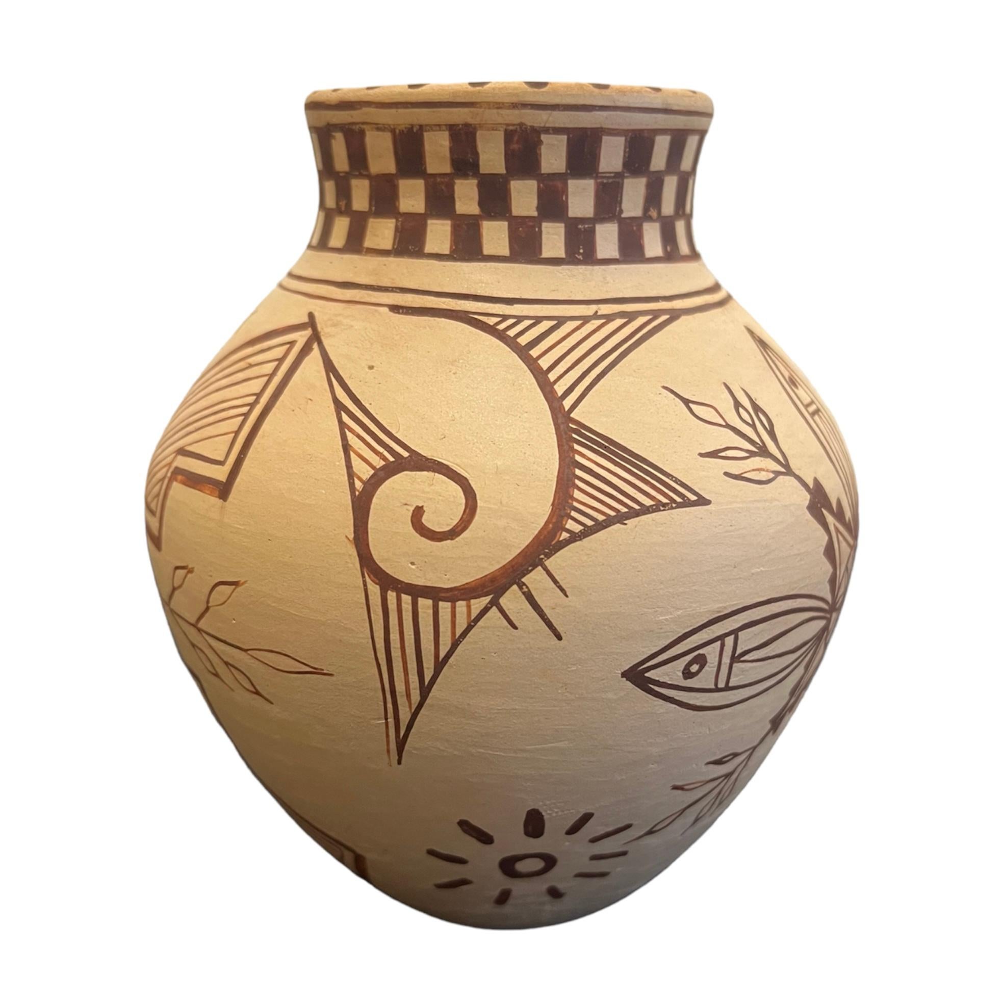 $750
A collaborative work by Jacob and Kelly Frye. Vase has a Hopi slip with hand painting in a  tansy mustard glaze.  

6”x 5”x 5”

Born in Santa Fe, New Mexico, Jacob Thomas Frye is a fourth-generation potter and painter from Tesuque Pueblo.