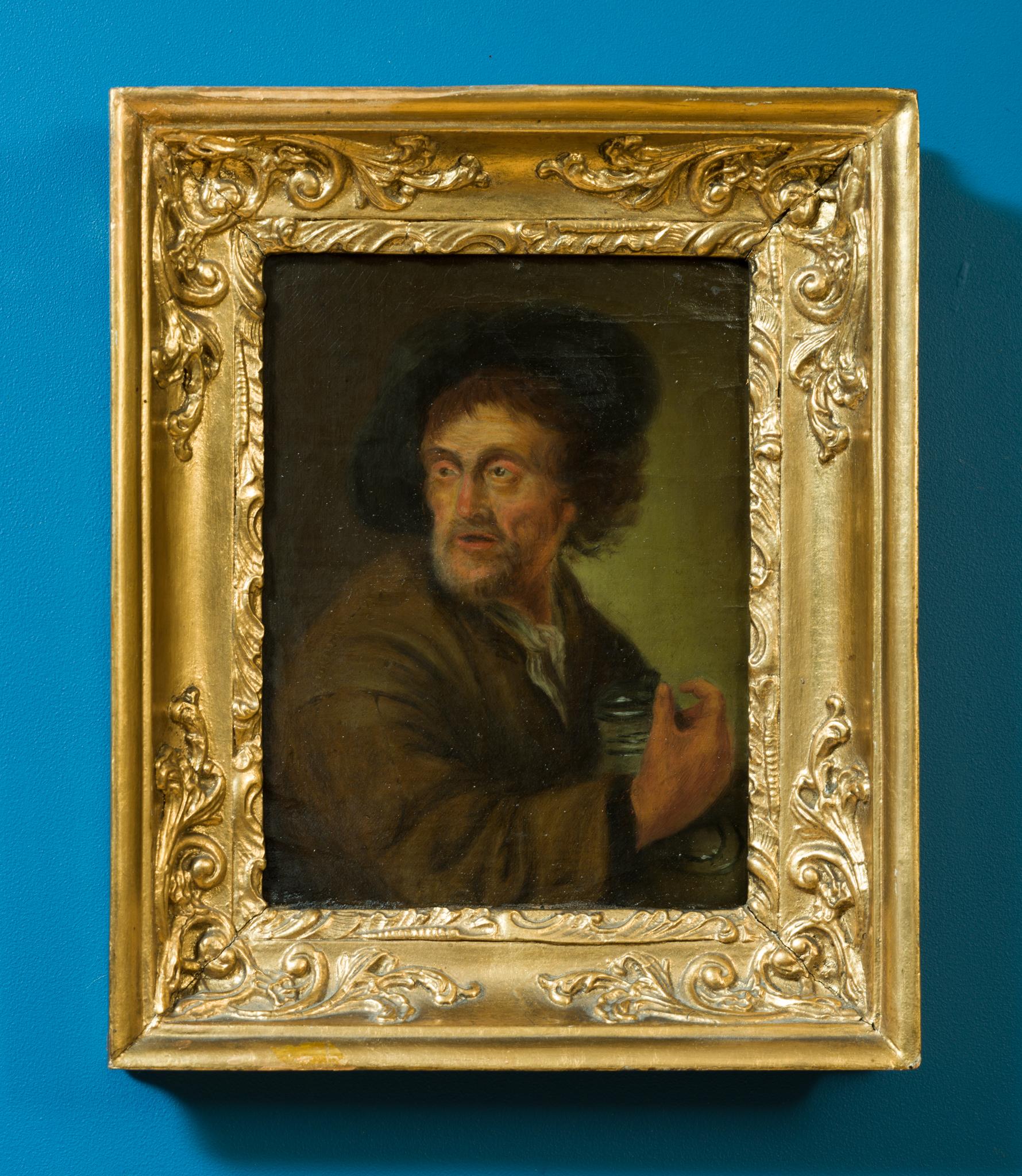 This evocative 19th-century painting is the work of a follower of the Dutch Golden Age artist Jacob Toorenvliet, known for his finely rendered genre scenes. Titled Man Holding a Jug (The Sense of Taste), the composition follows a well-known original