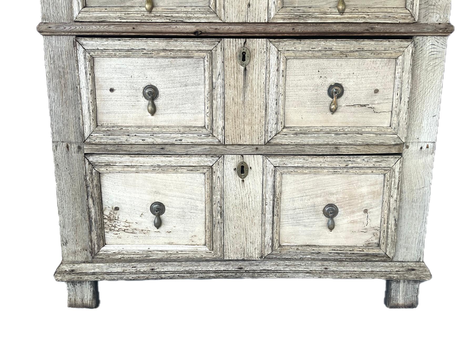 17th Century English Jacobean Oak Chest with Bleached Finish. Chest features three tiers of drawers with a total of six drawer fronts. Chest has a sophisticated bleached finish that highlights the rich grain and character of the wood, while