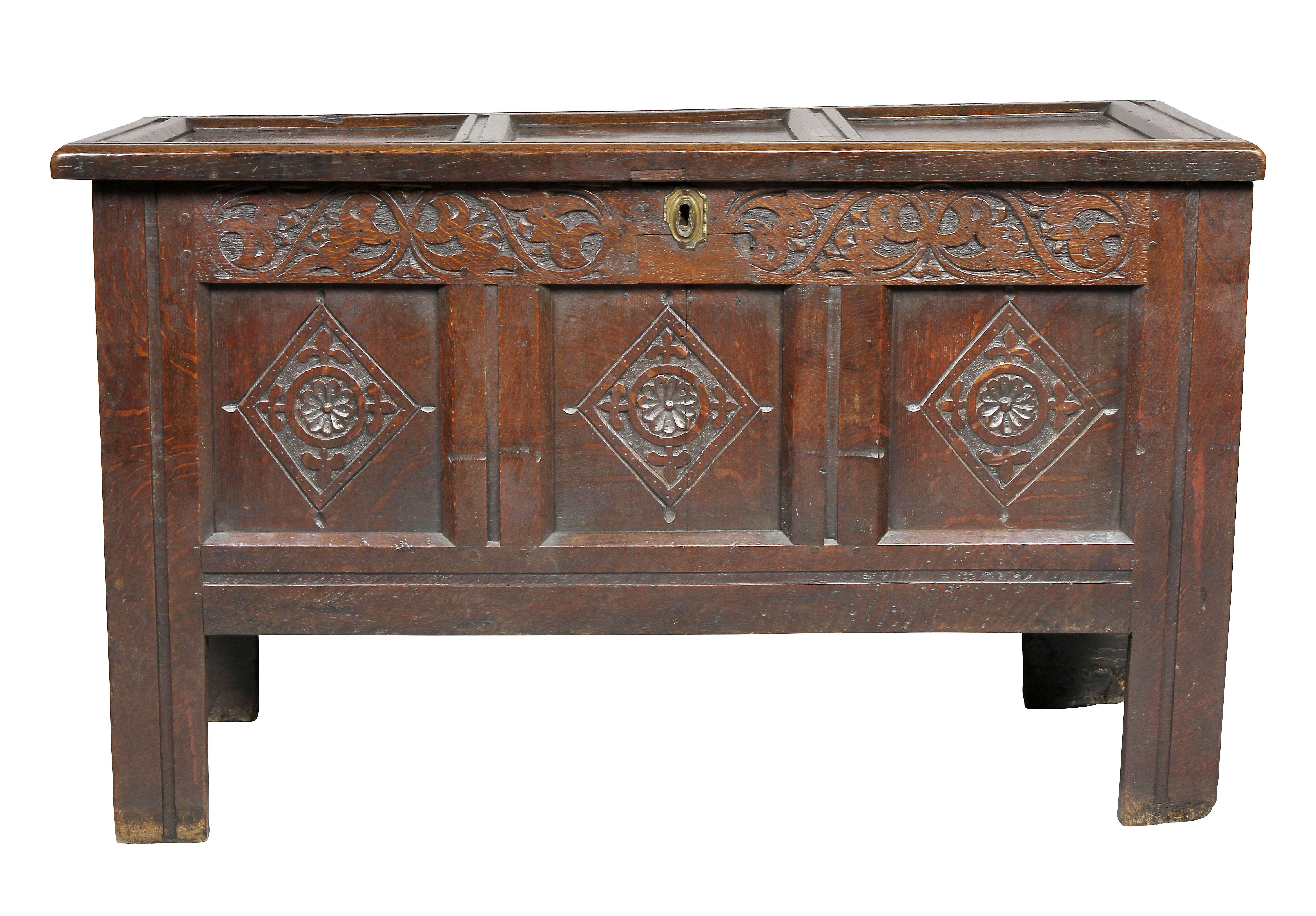 Nice small proportions with paneled hinged lid over a conforming case with three panels with carved detail, square section legs.
