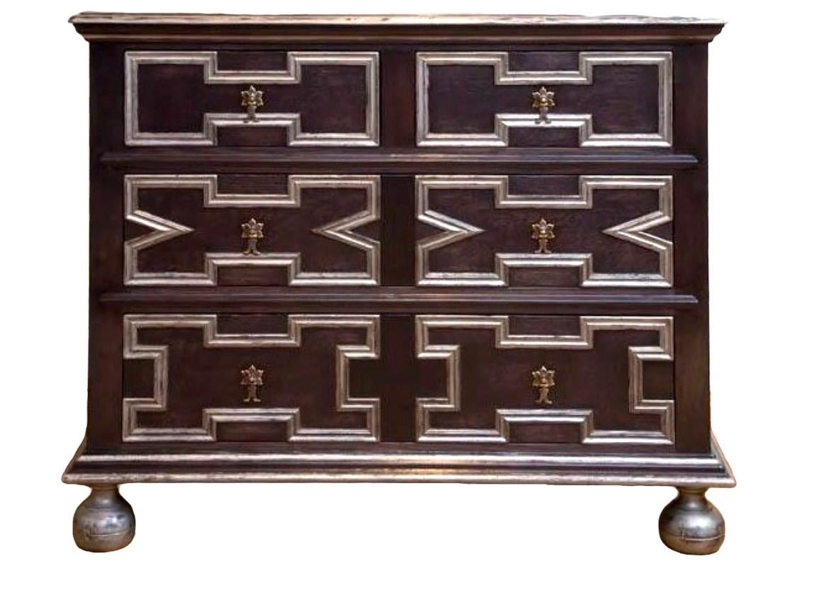 Jacobean Revival Ebonized Oak and Silver relief Chest of Drawers 
made in solid English Oak using the best high end cabinet makers.

A fresh to market finish using a non painted stained base colour leaving the base timber transparent.
Slight