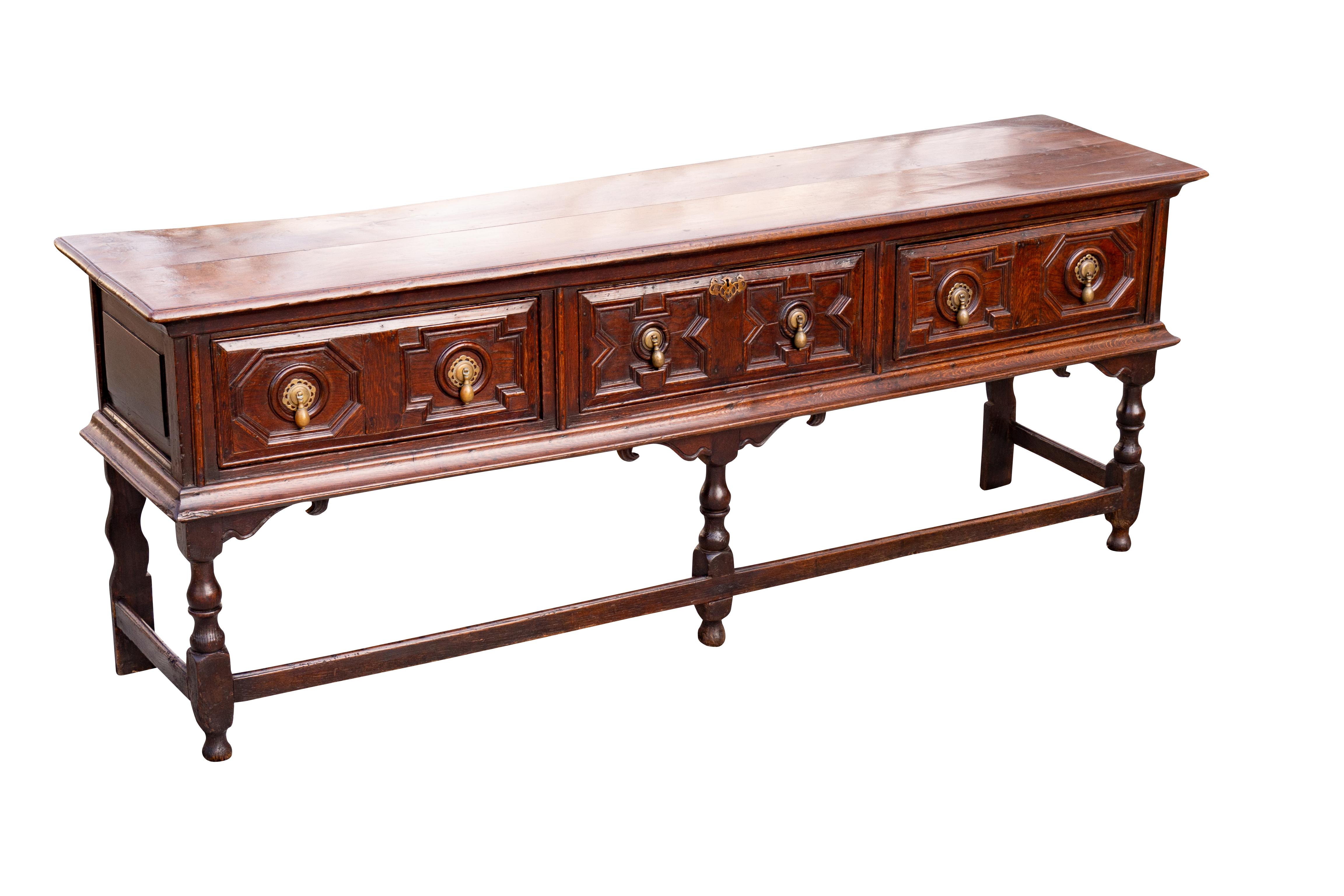 A very good example of good proportions and color with little restoration with the exception of the finish. Original hardware. Rectangular two board top over three nicely panelled drawers raised on three turned front legs with bracket form