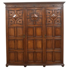 Jacobean Revival Carved Oak Triple-Door Wardrobe