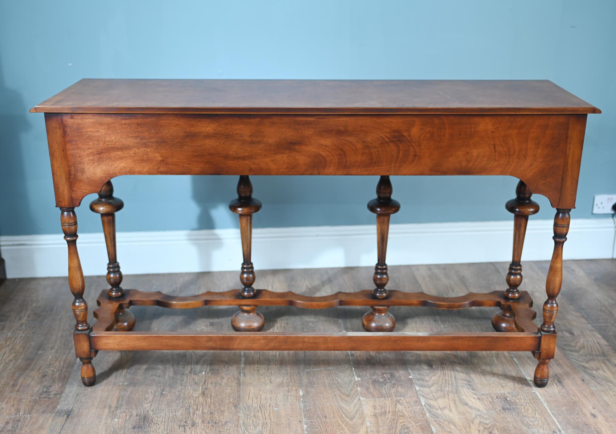 Wonderful Jacobean Revival dresser in walnut
Circa 1930
Great for achieving that sought after farmhouse look
Bought from a house call in St Albans
Six turned legs connected by an intricately shaped stretcher, providing both stability and stylistic