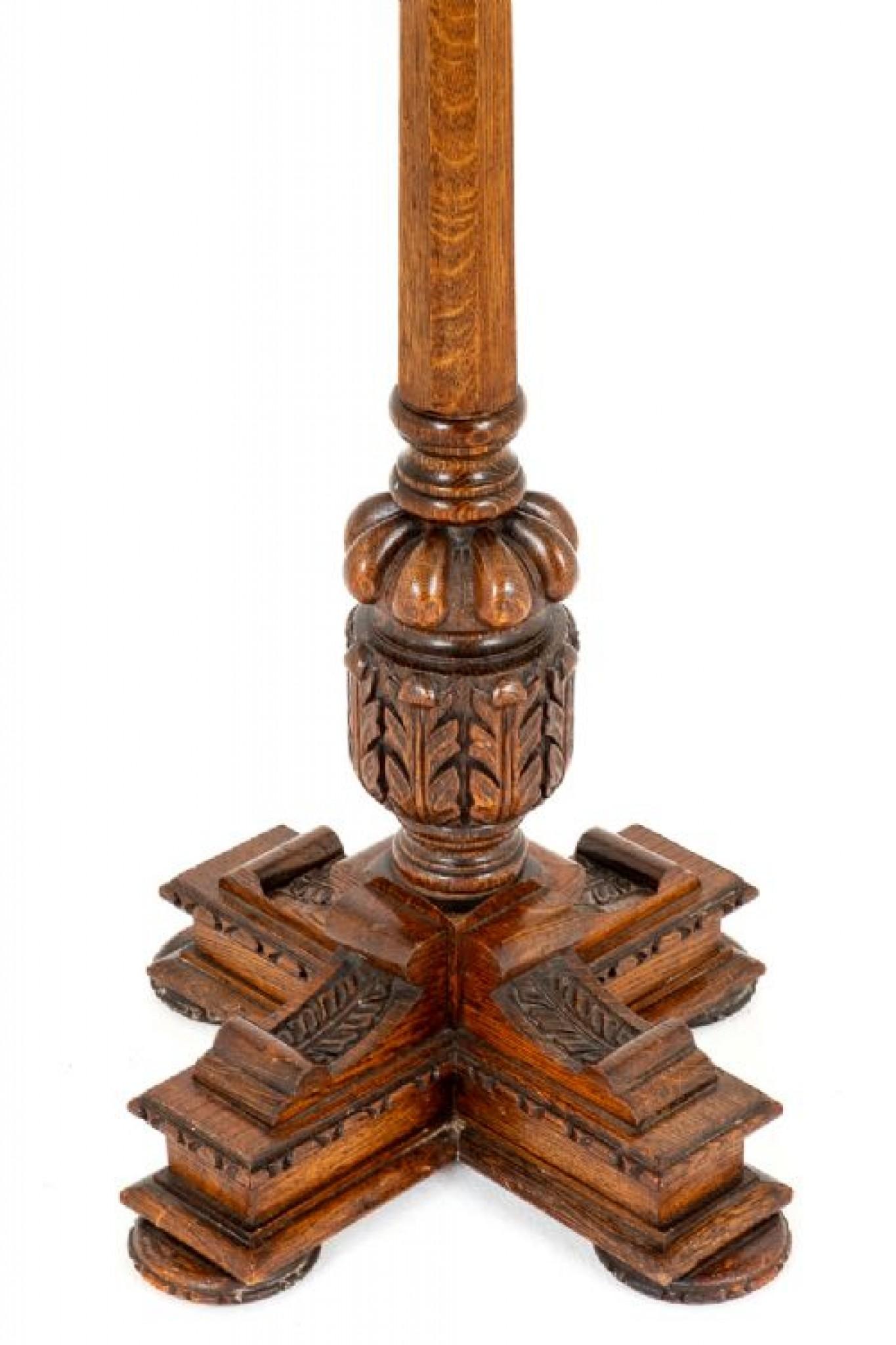 Carved oak Jacobean Style lampstand.
circa 1930
This lampstand is raised upon a carved base with a typical Jacobean style turned and carved column.
Comes complete with shade.