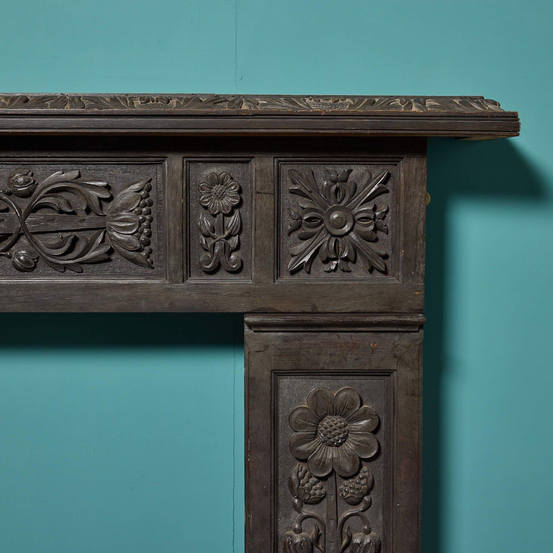 English Jacobean Style Carved Dark Oak Fire Mantel For Sale