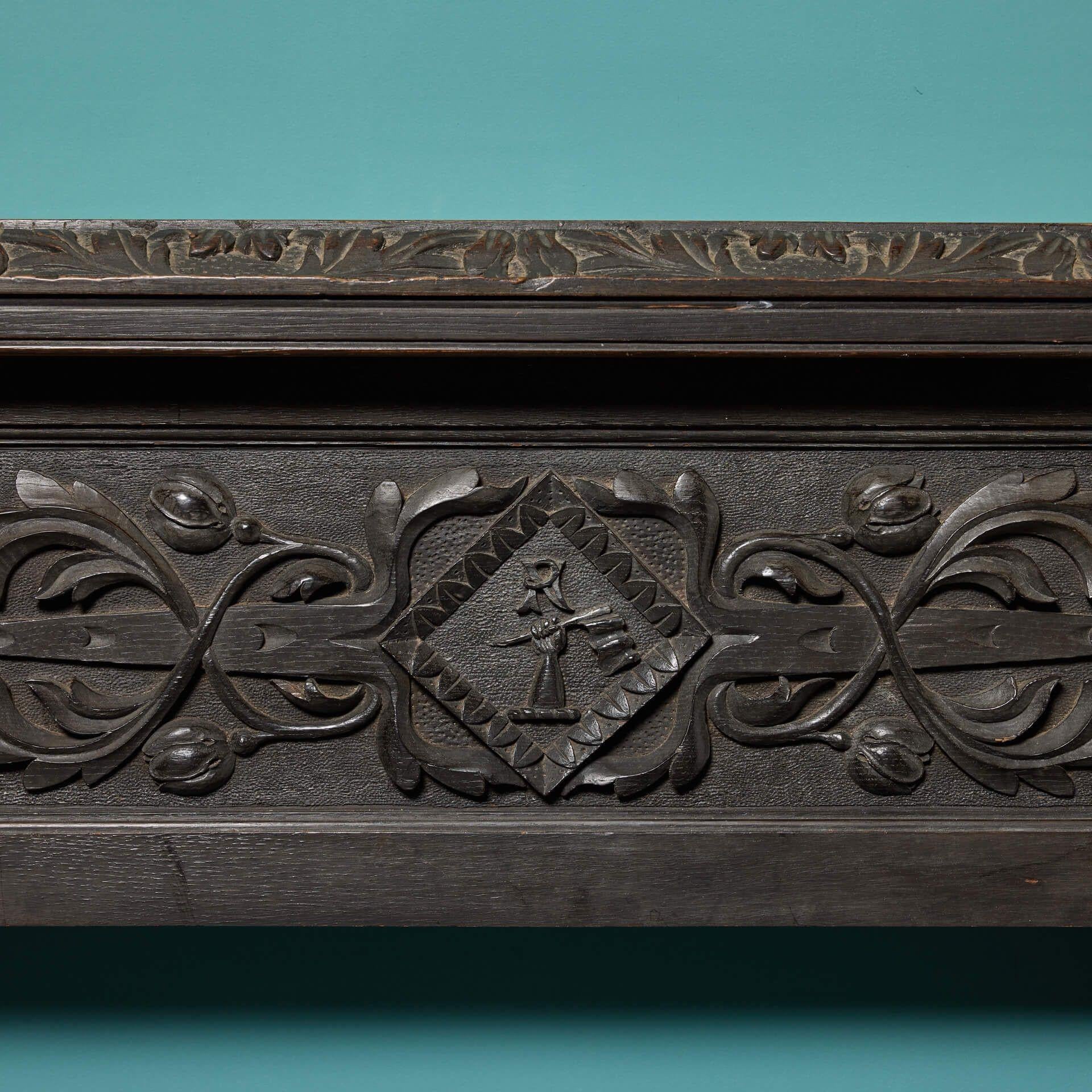 19th Century Jacobean Style Carved Dark Oak Fire Mantel For Sale